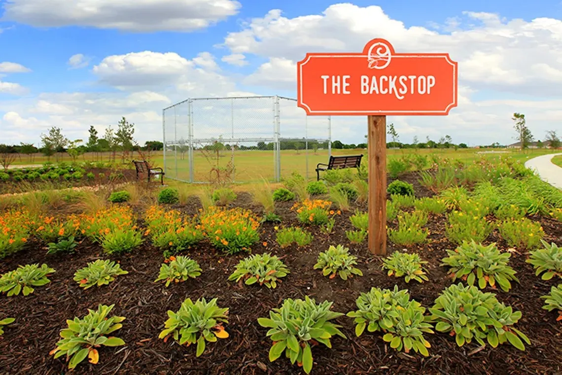 garden and baseball backstop