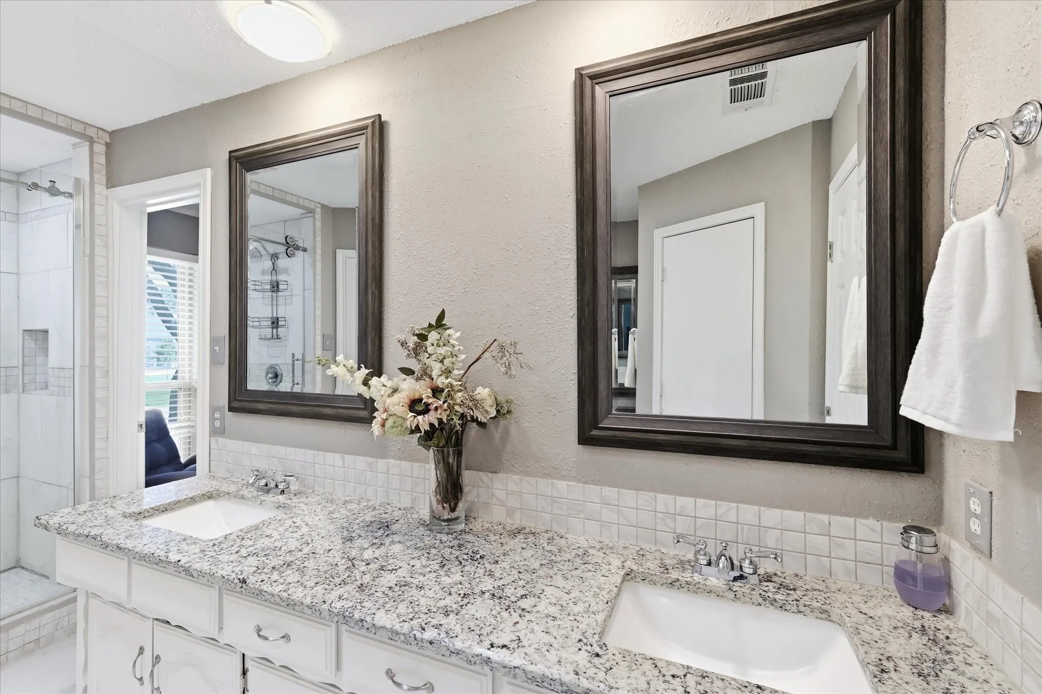 Dual sinks and framed mirrors.