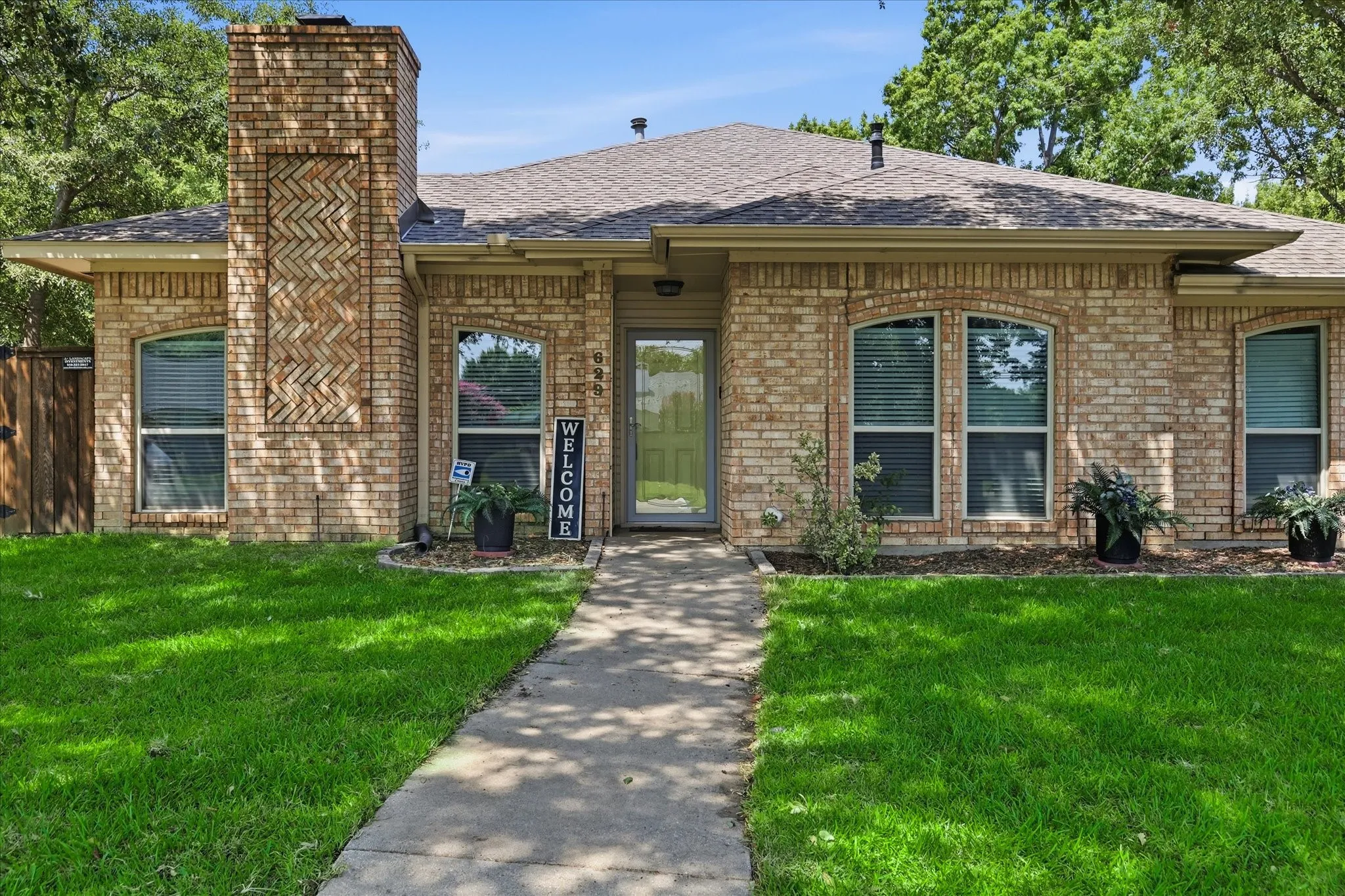 Inviting entry with freshly laid sod.