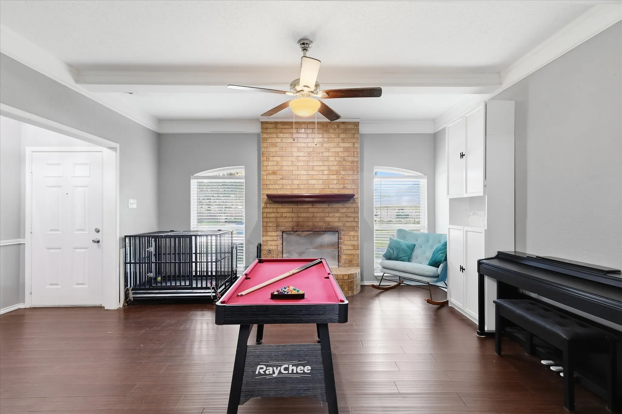 Floor to ceiling brick fireplace.