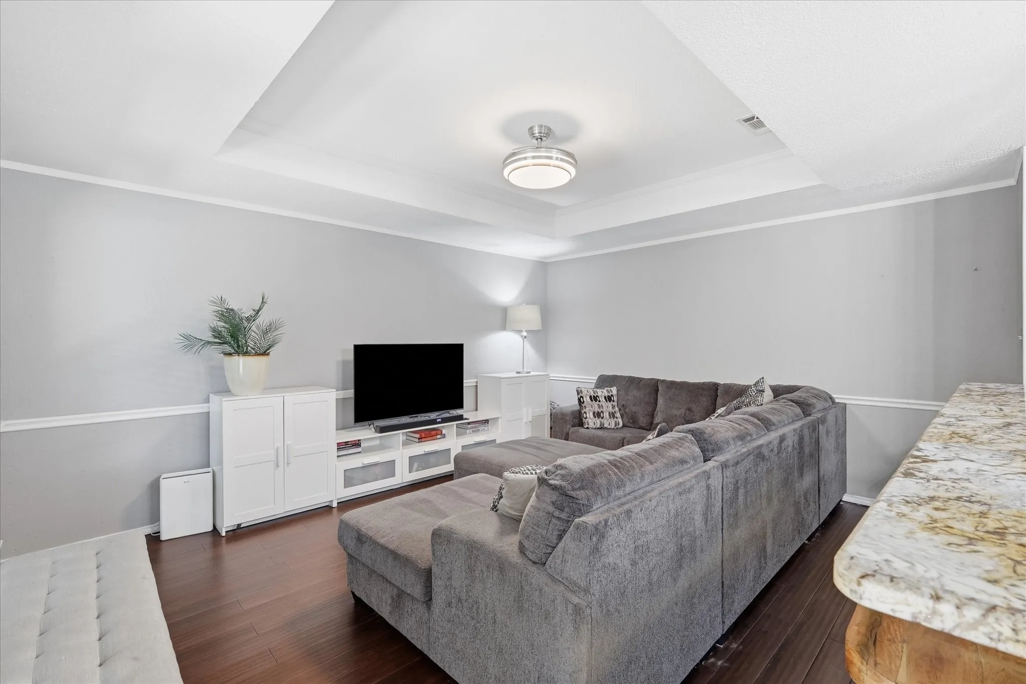 Recessed ceiling and updated light fixture.