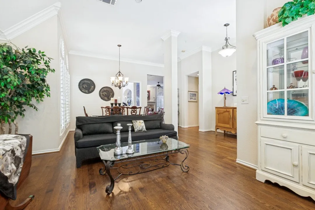 Hardwood flooring throughout, vaulted ceilings, plantation shutters, and crown molding