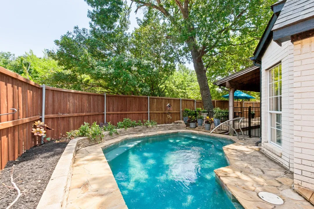 Outdoor pool with flagstone coping and surrounding patio