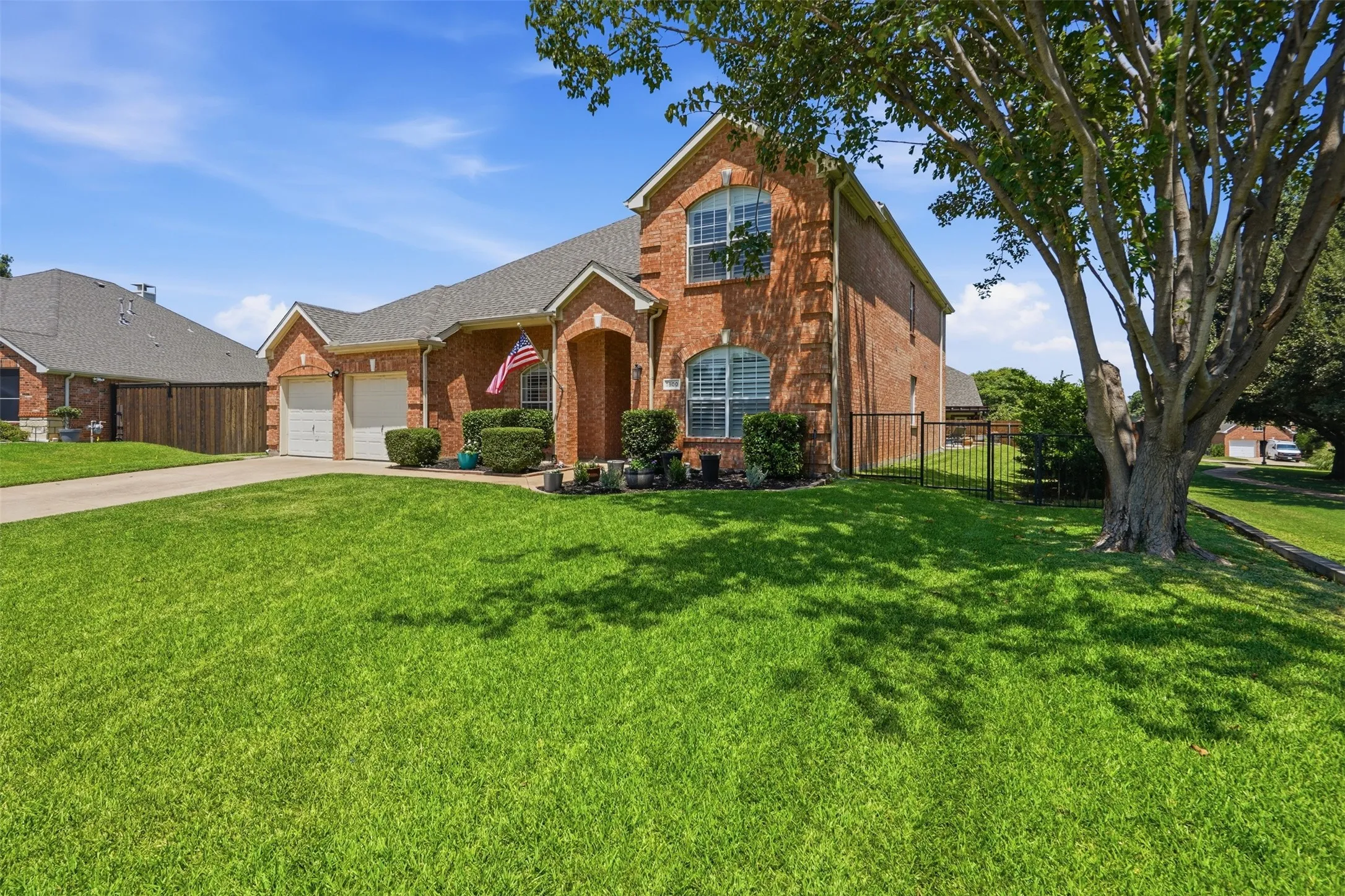 Oversized, meticulously maintained front yard enhances the home's curb appeal.