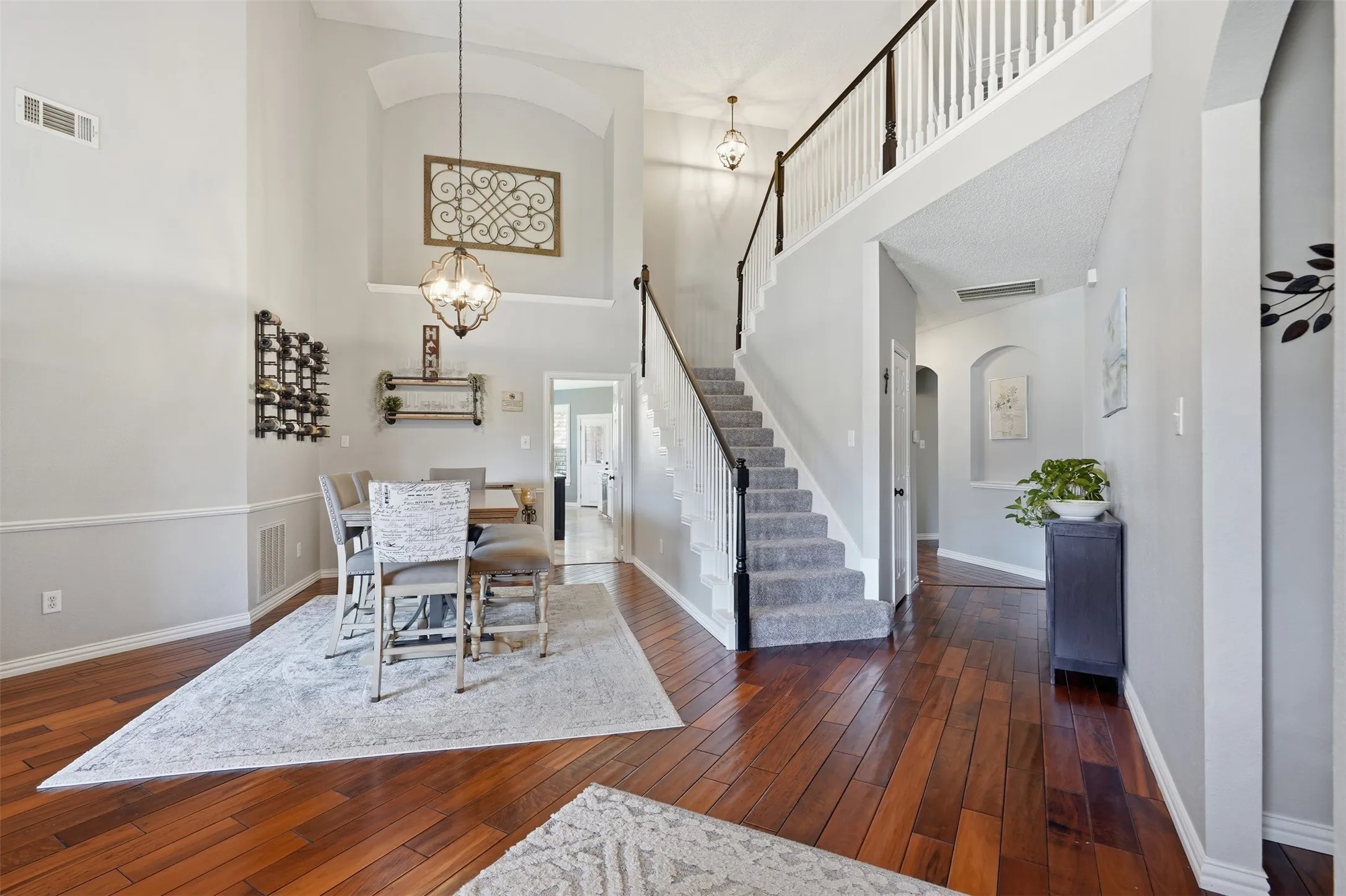 A soaring two story foyer welcomes you with rich hardwood floors and lots of natural light.
