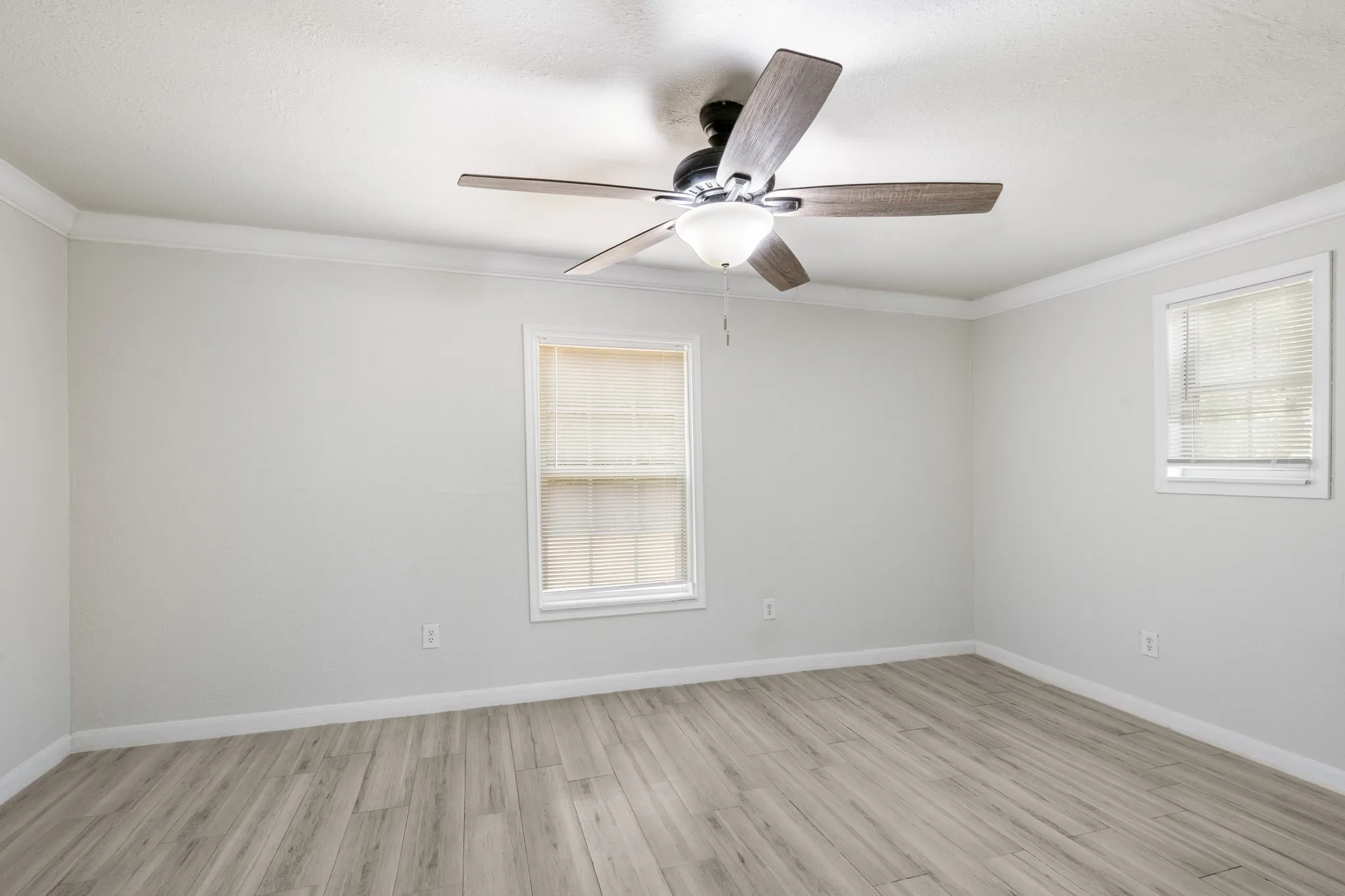 All bedrooms feature hard surface flooring, and the home has all new windows.