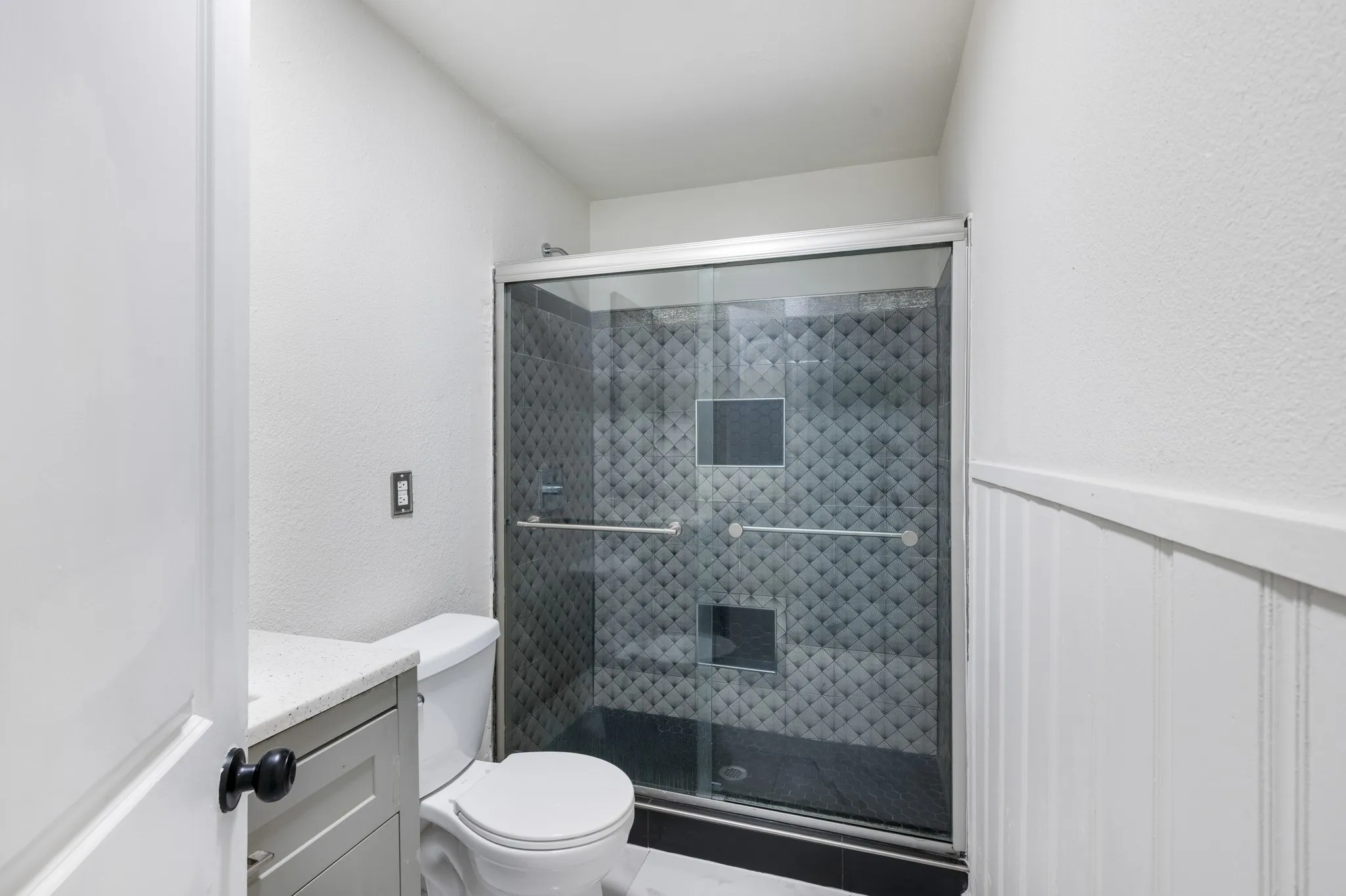 Updated bathroom with beautiful shower.