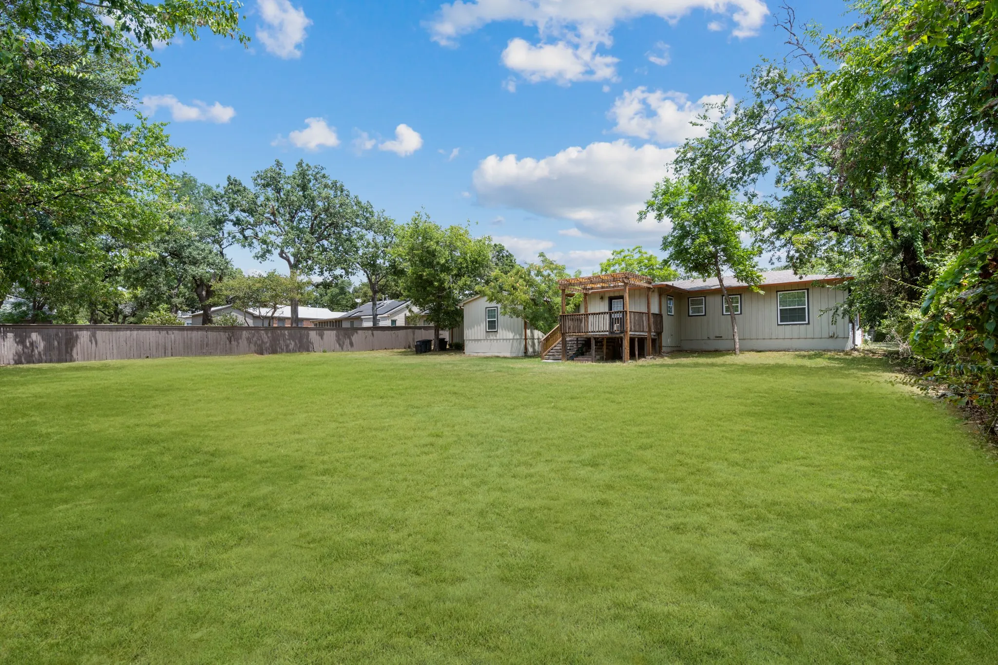 Large backyard for play and outdoor entertaining. *Grass enhanced to show potential*