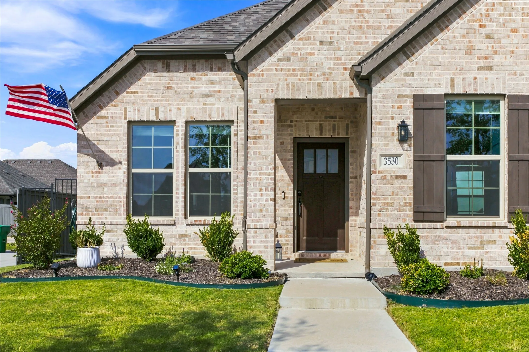 Covered entry and attractive exterior details create a warm first impression.