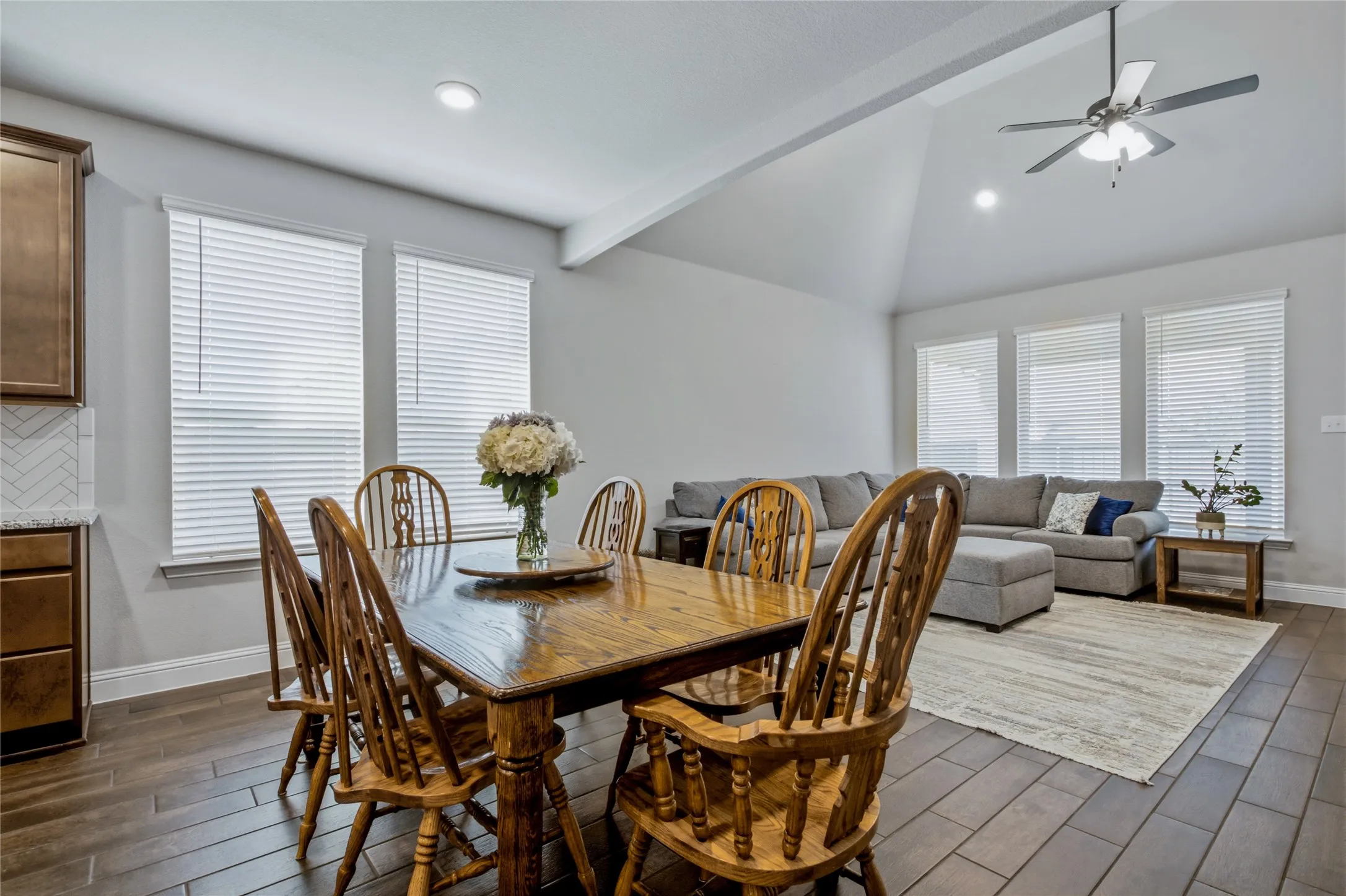 Spacious dining area positioned adjacent to the kitchen and open living space for seamless entertaining.