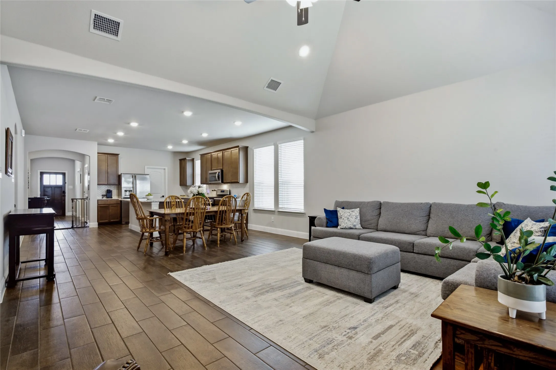 Open-concept design creates a natural flow between the living room and kitchen.