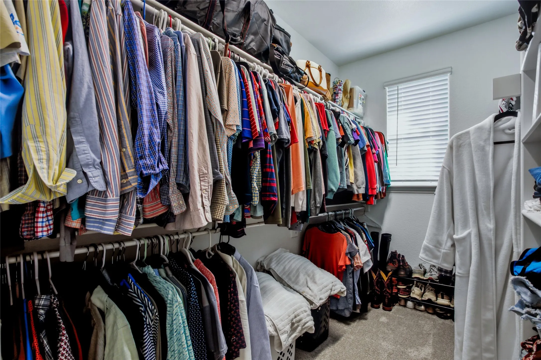 Expansive walk-in closet offering excellent storage and organization space.