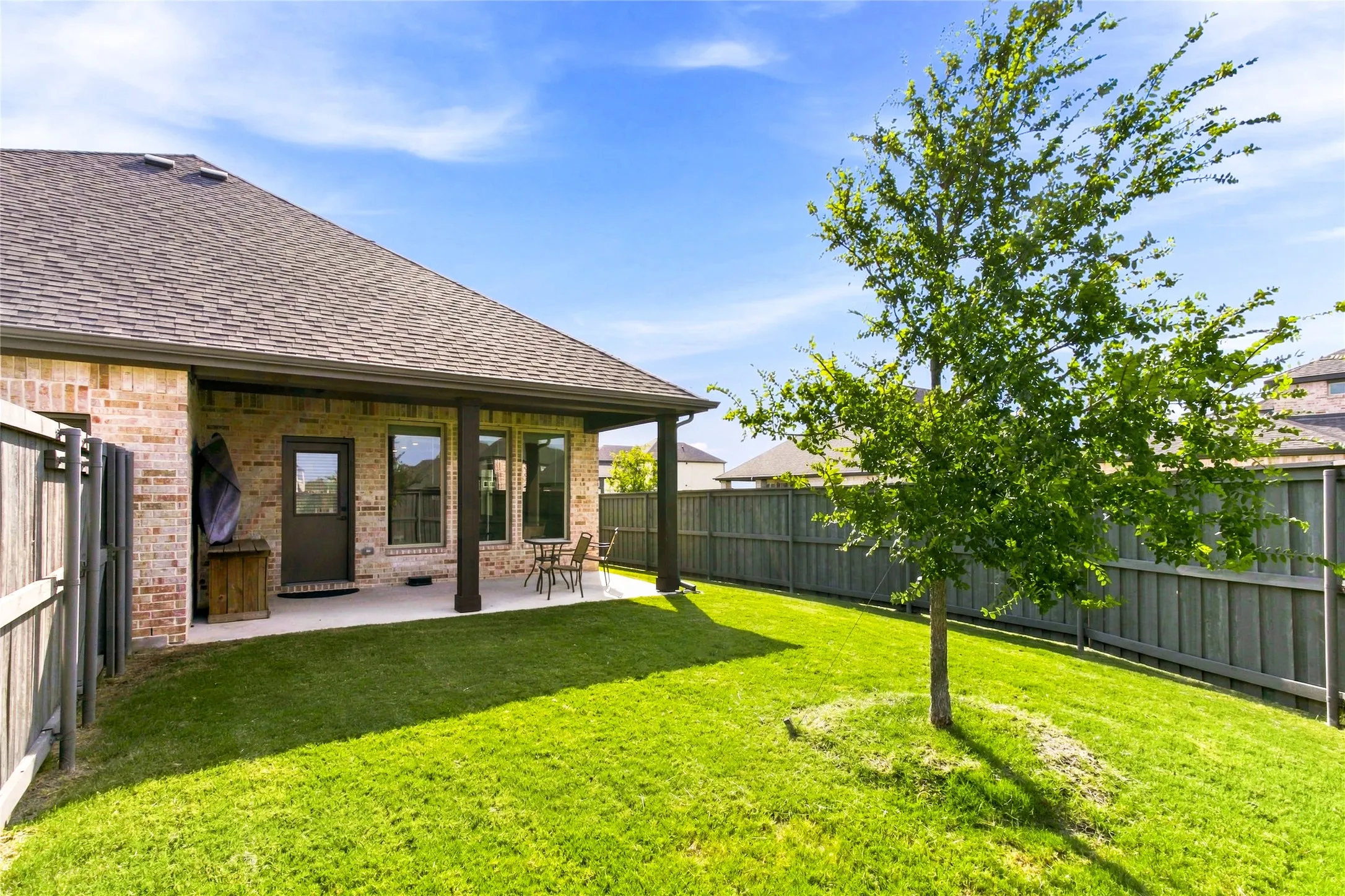 Generous backyard with covered outdoor living space and room to enjoy the outdoors.