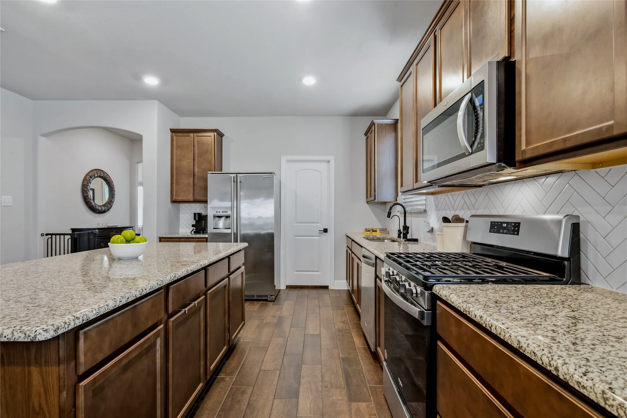 Well-appointed kitchen with abundant cabinetry, generous counters, and an open connection to the living areas.