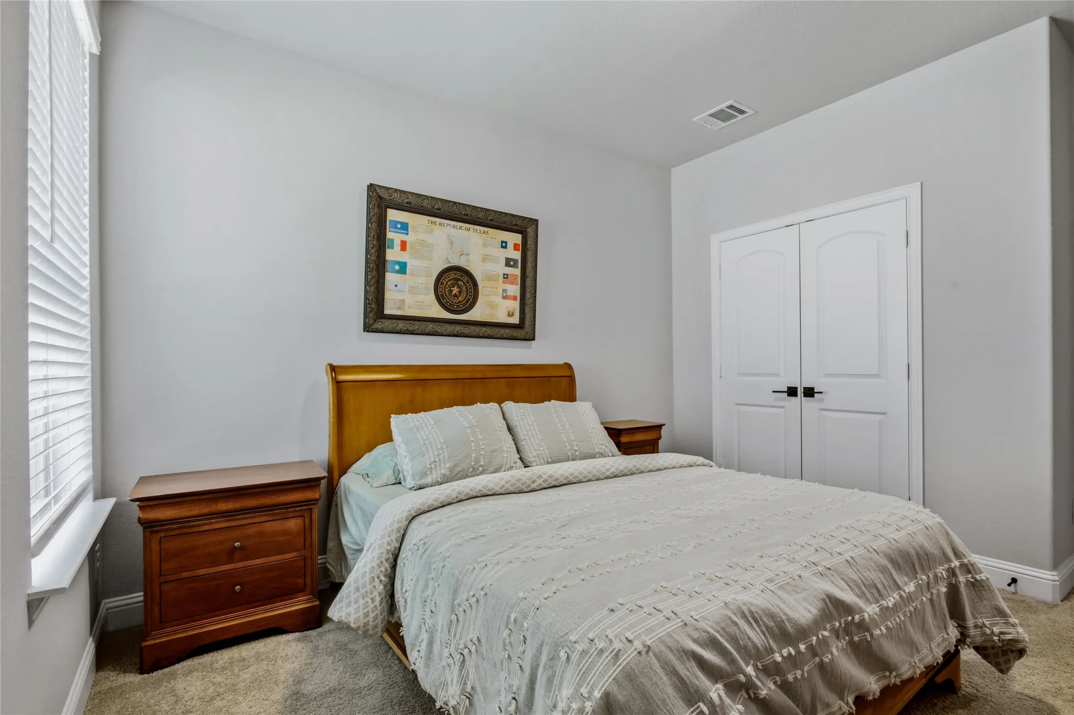 Well-sized bedroom with a bright, inviting atmosphere and ample room for furnishings.