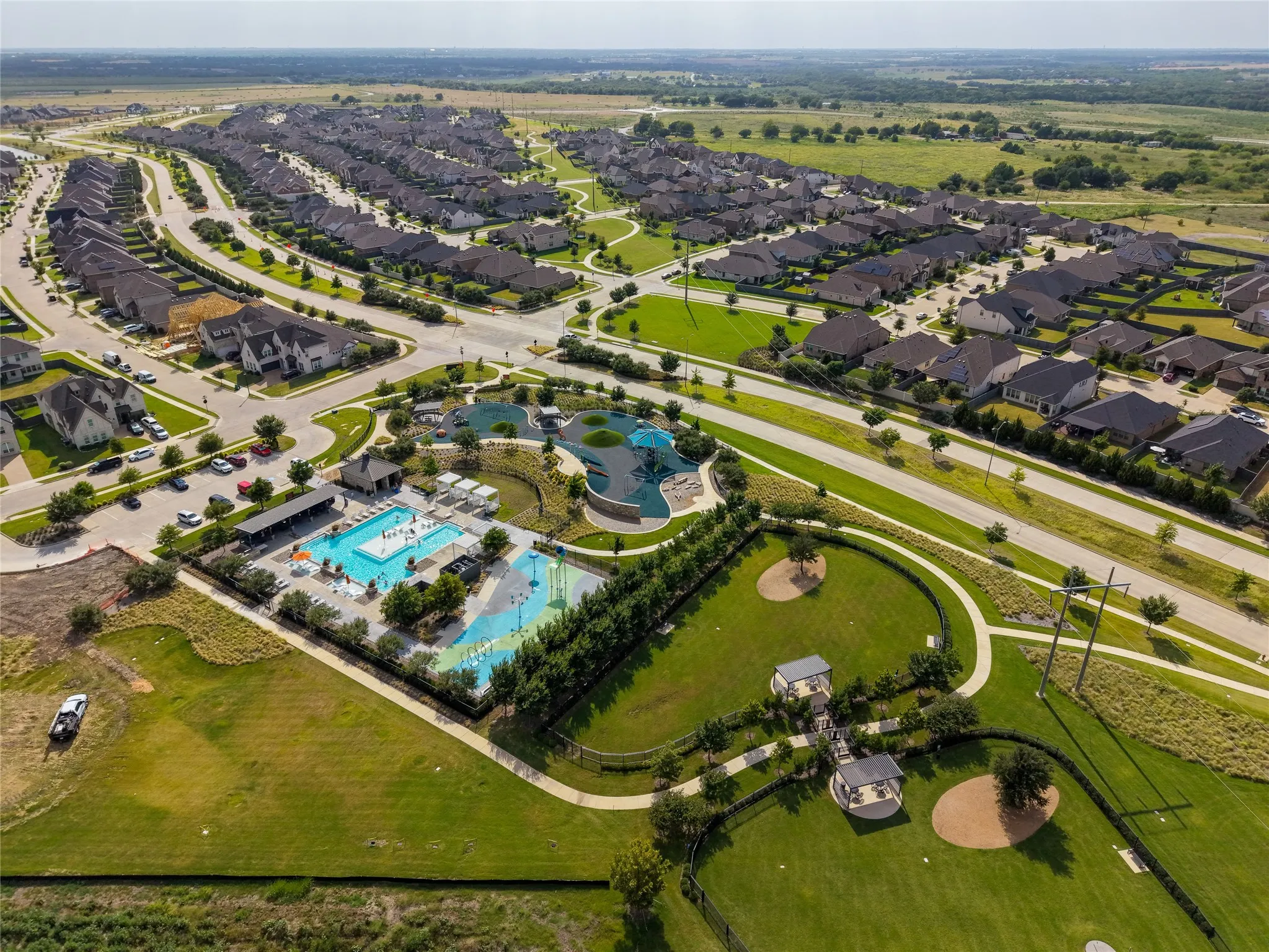  Aerial view showcasing the expansive community recreation and amenity areas.