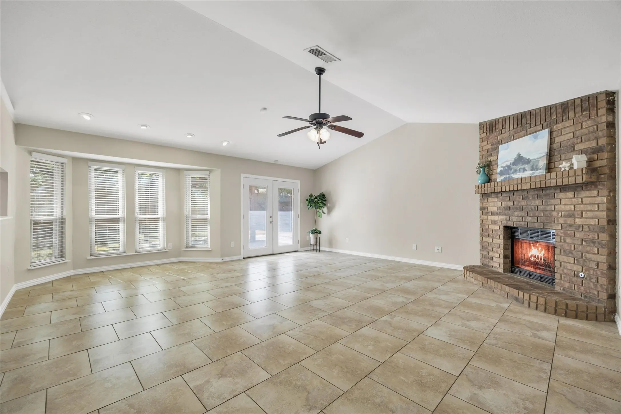Central great room measures 20x21-ft so there's room for furniture plus a dining room table in any direction.