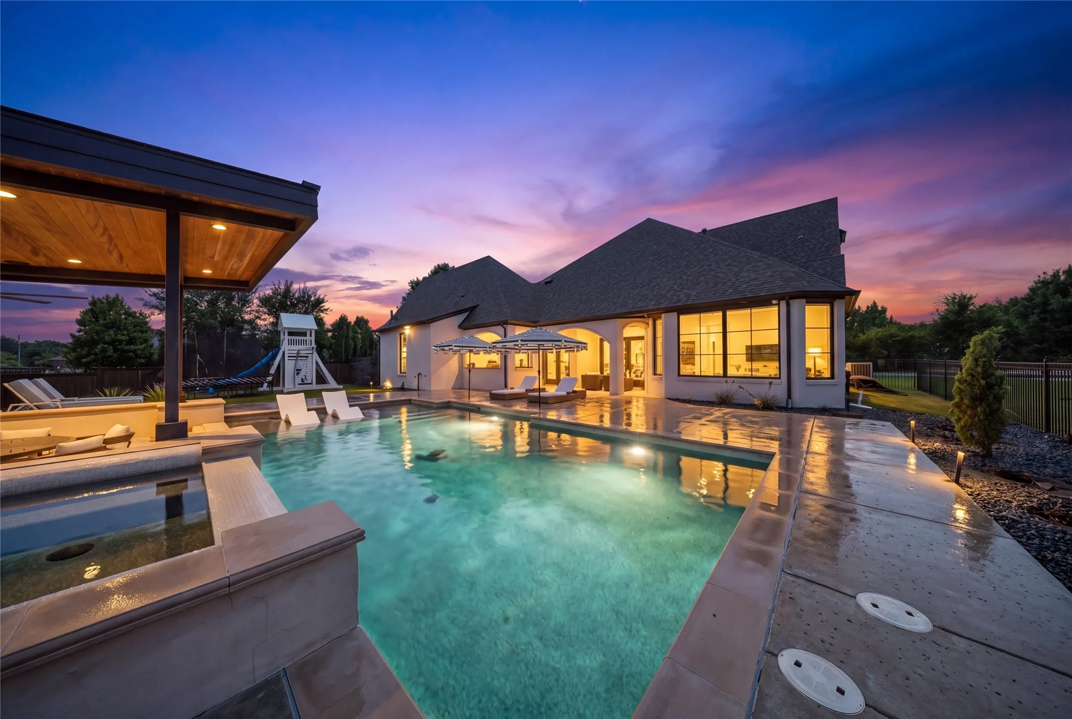 Enjoy evenings at the pool-side cabana with a TV, fire pit, and beverage fridge.