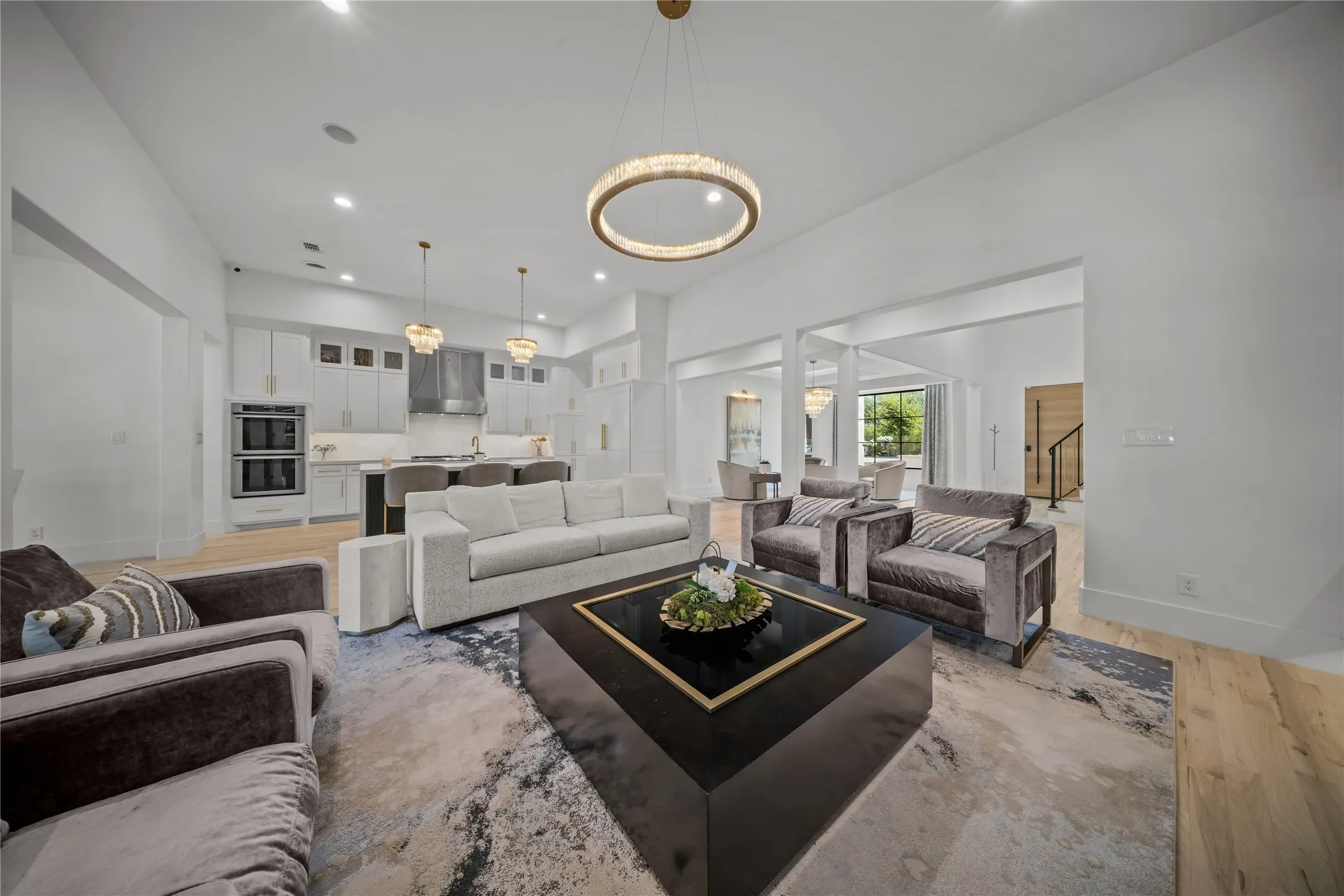 Open floor plan with newly framed walls, modern wall features, and architectural details added.