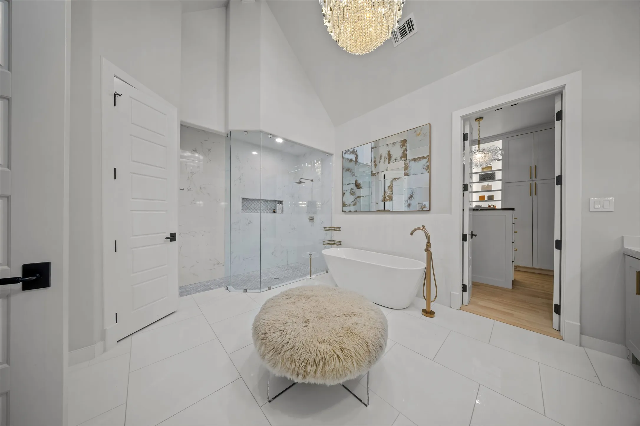 Renovated master bath with vaulted ceilings, decorative lighting, oversized stall shower.