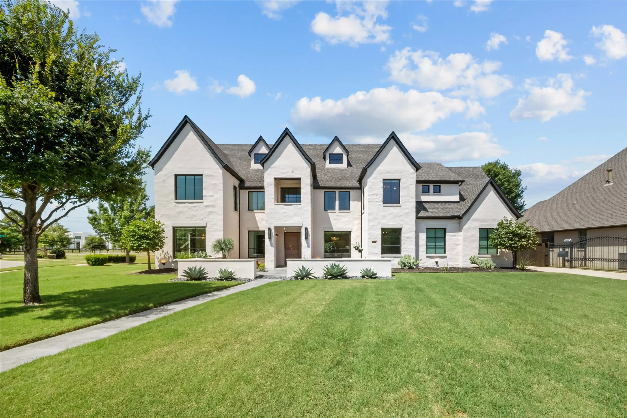 Enjoy $1M in improvements, including Marvin black-frame windows and a messy mortar-and-stucco finish for luxurious curb appeal.