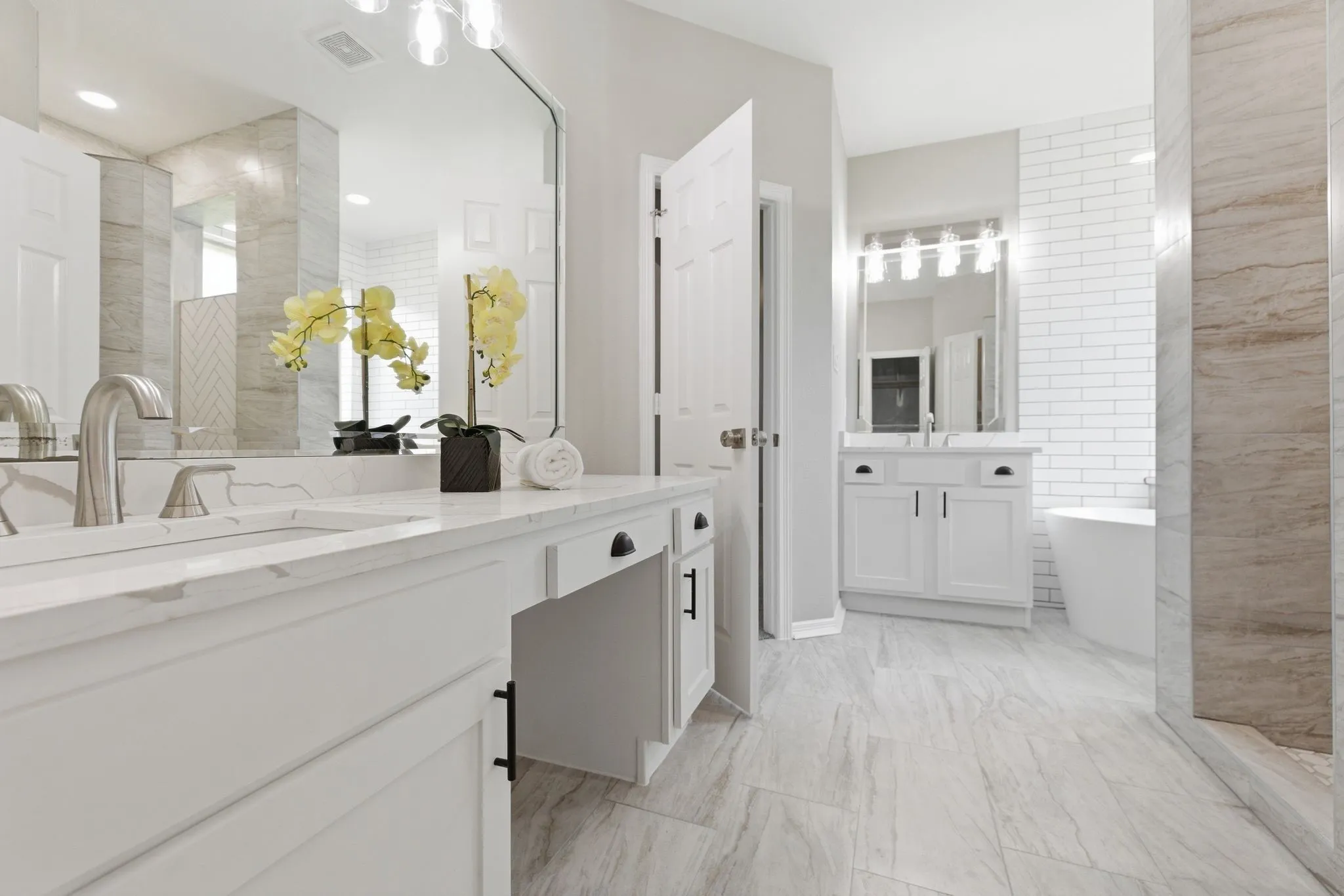 Dual vanity with integrated sinks and brushed nickel fixtures