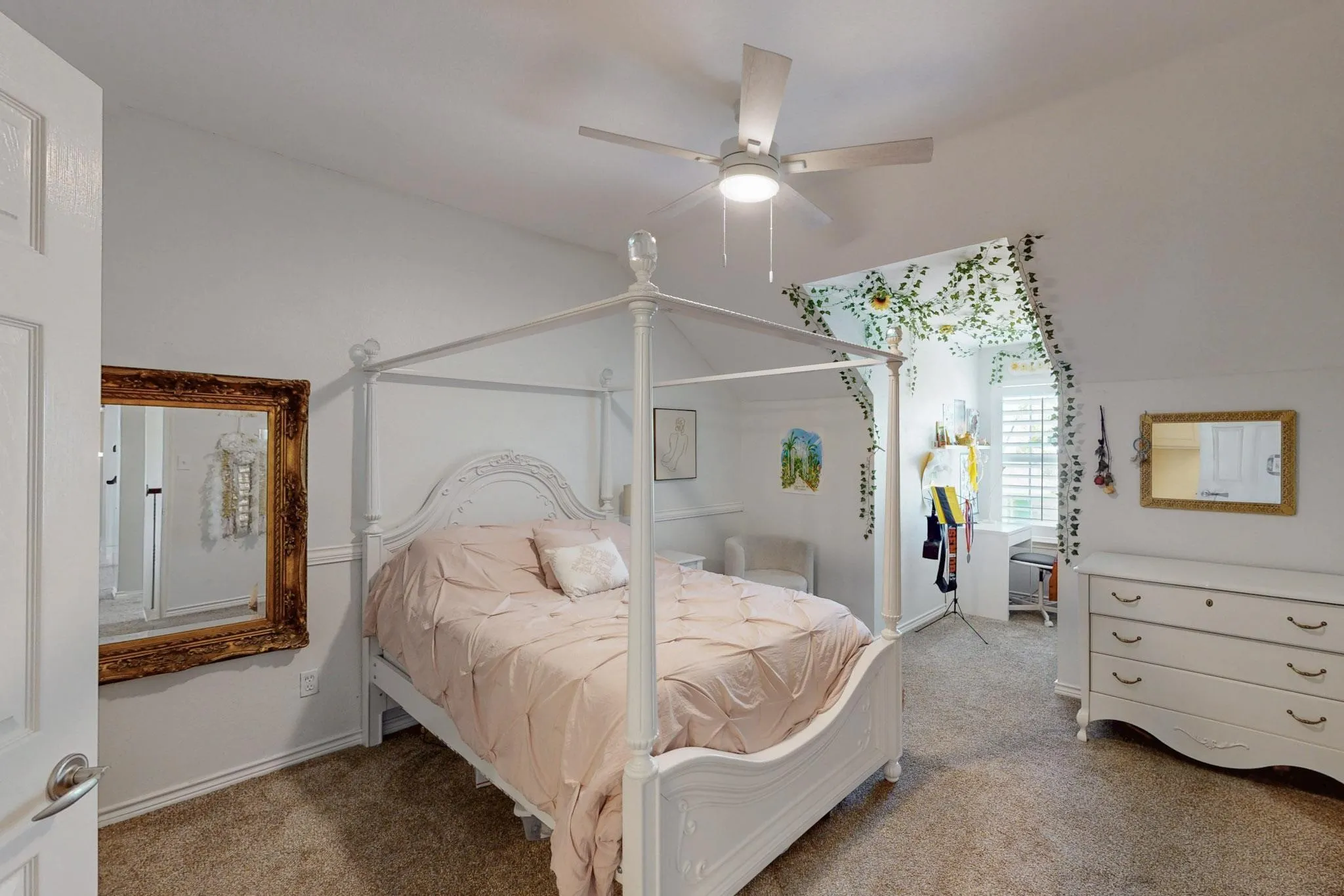 Vaulted ceiling, ceiling fan, carpeted flooring, built-in window nook, plantation shutters