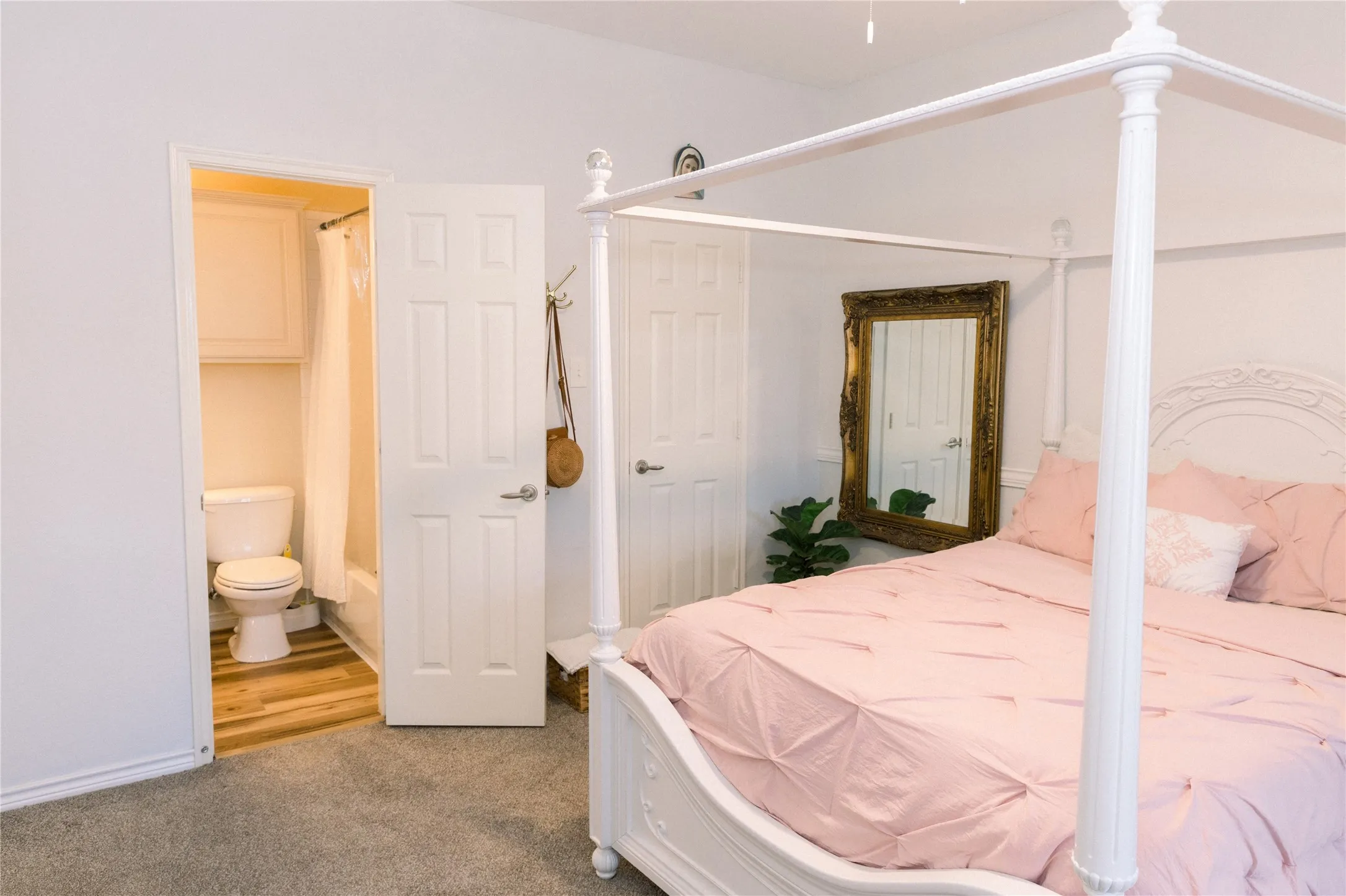 Attached bathroom featuring a built-in cabinet