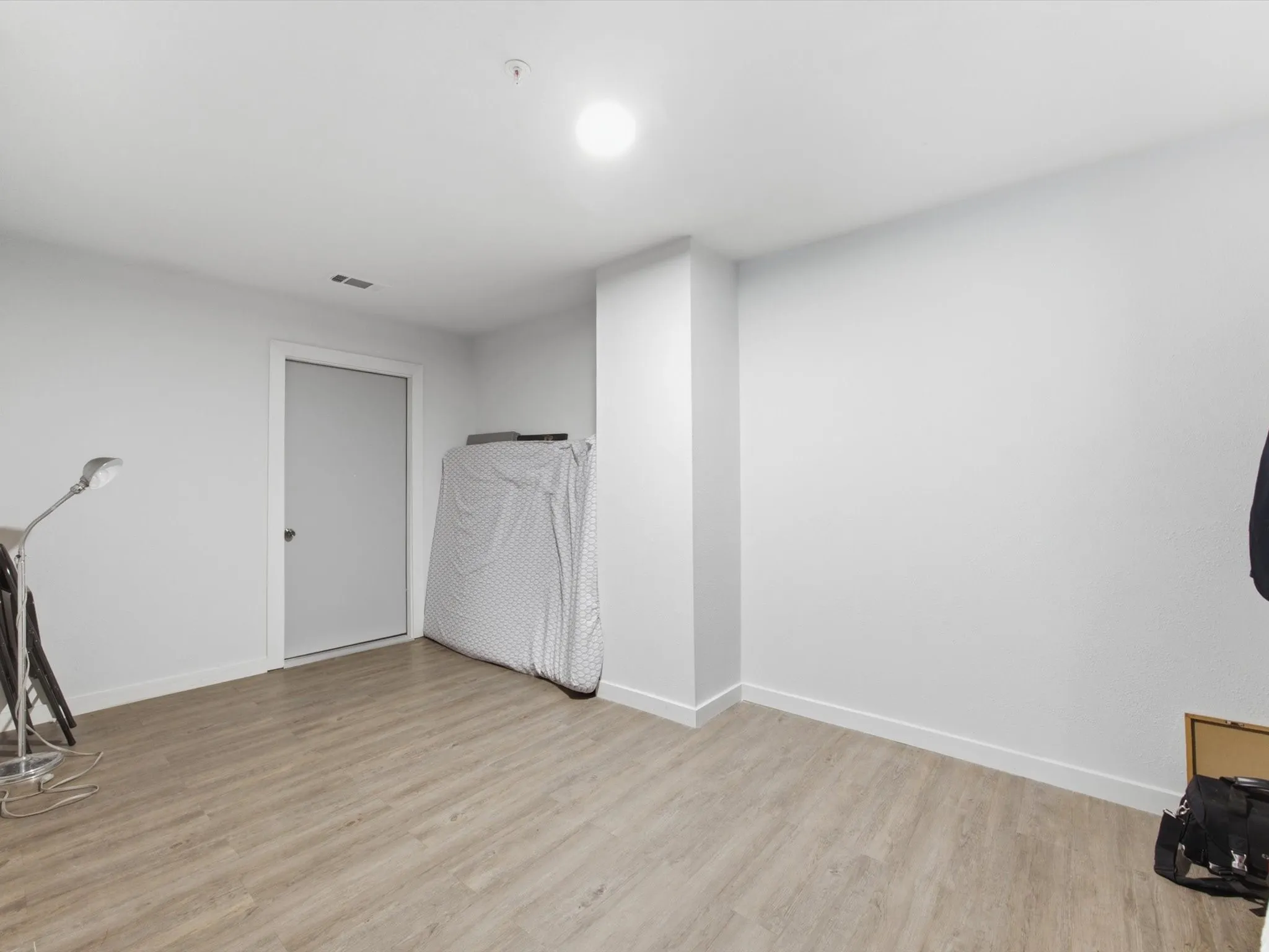 Bonus Room upstairs with recessed overhead lighting illuminates this living space, featuring wood-finish flooring and a light-toned wall finish