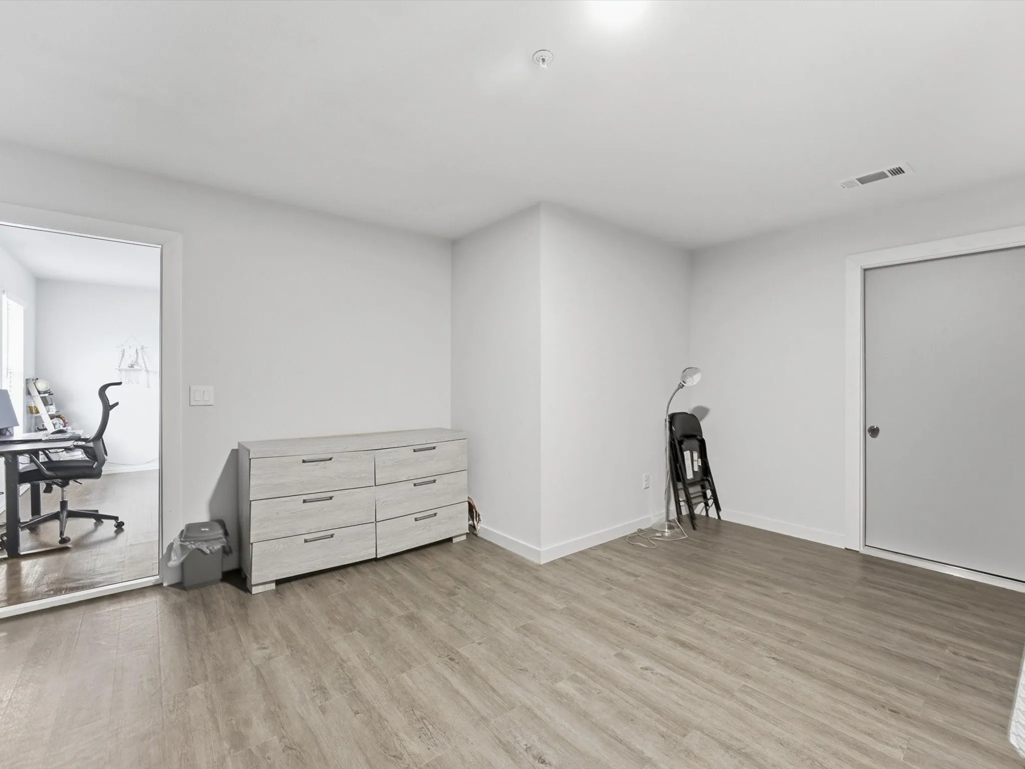 Bonus Room upstairs with recessed overhead lighting illuminates this living space, featuring wood-finish flooring and a light-toned wall finish
