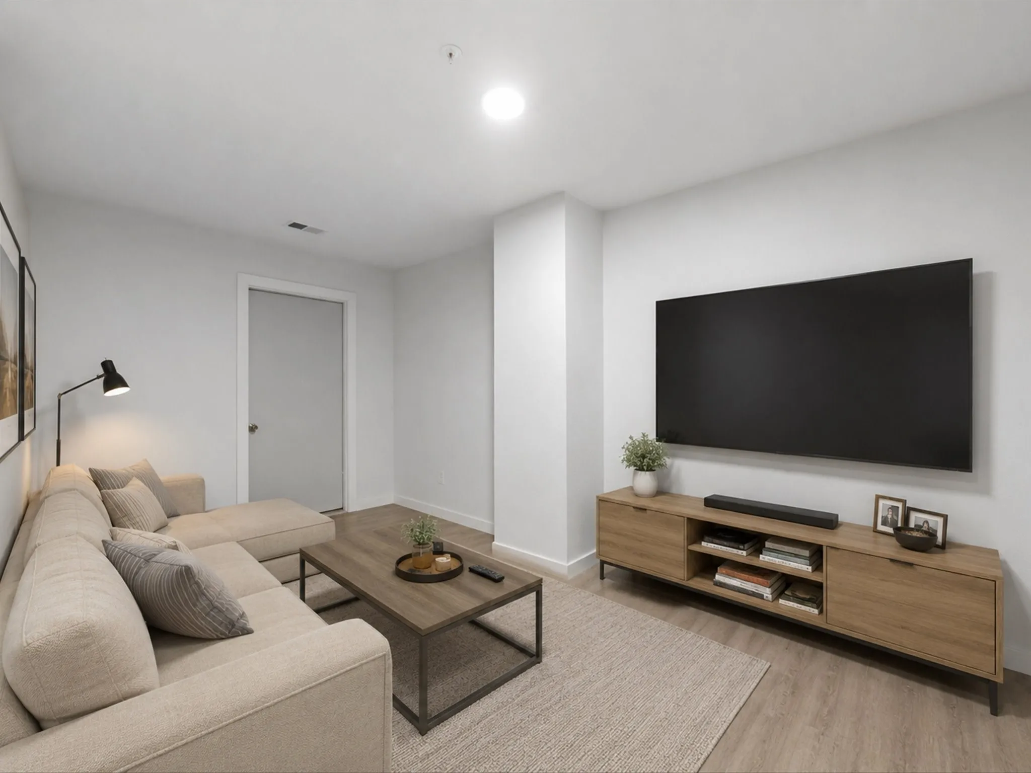 Virtually staged upstairs Bonus Room with recessed overhead lighting illuminates this living space, featuring wood-finish flooring and a light-toned wall finish