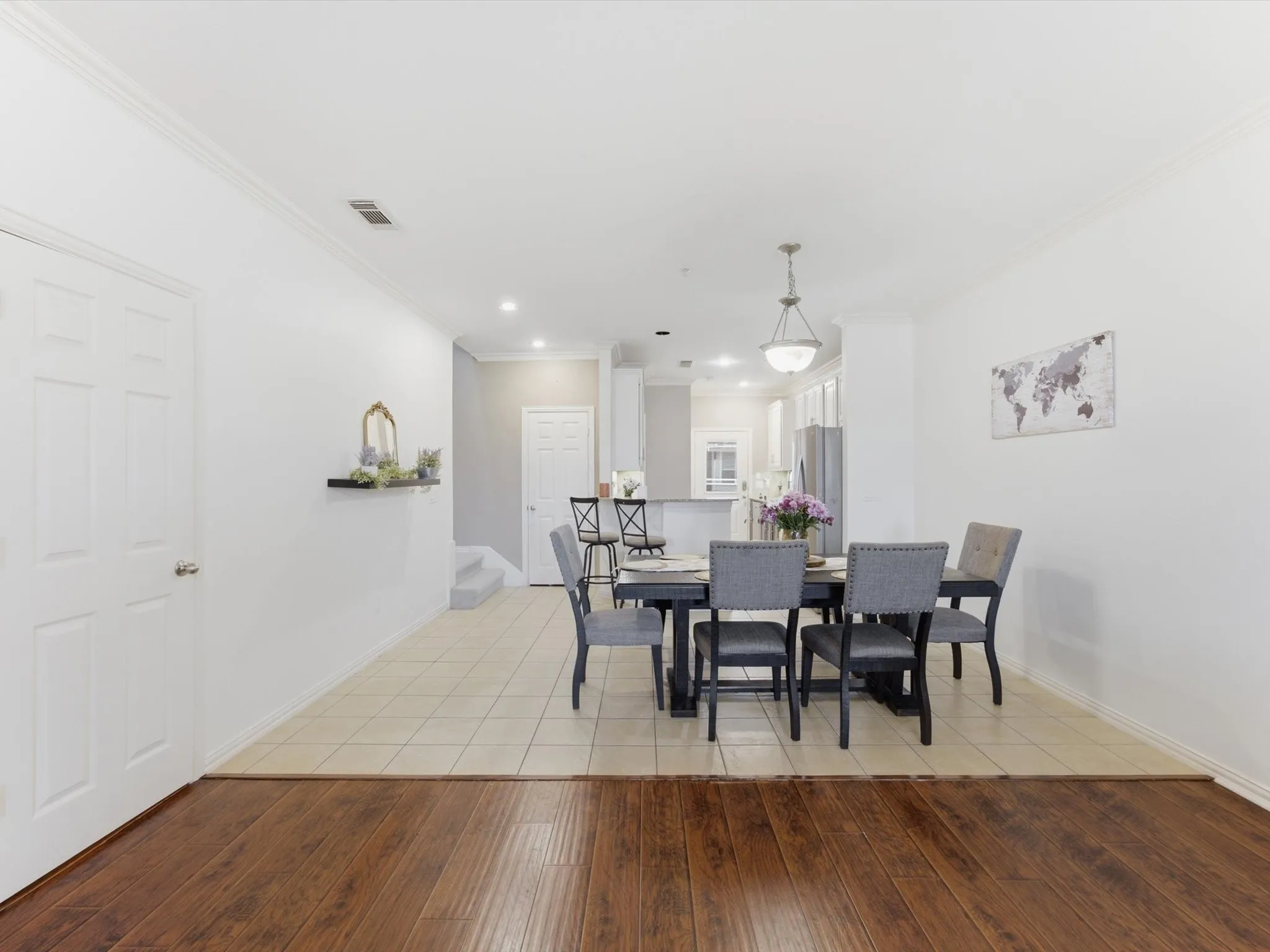 Wood-finish flooring transitions to tile flooring
