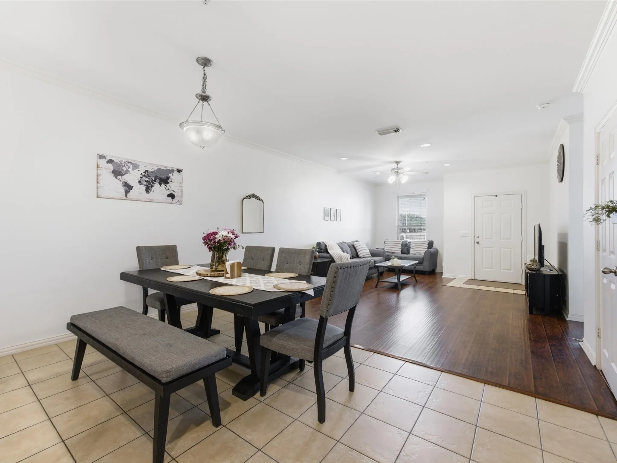 Tile flooring, wood-finish flooring, recessed lighting, ceiling fan, and crown molding