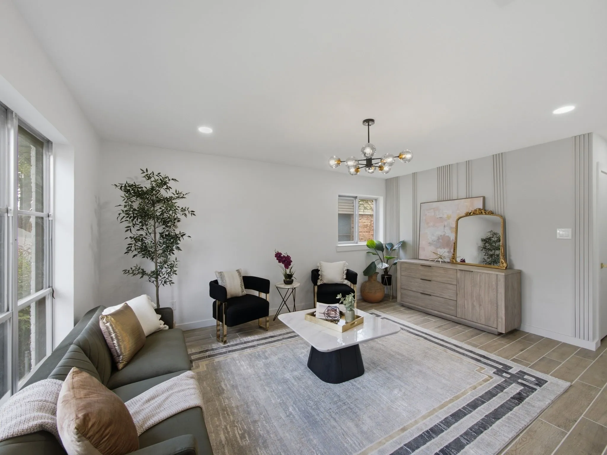 Recessed lighting, contemporary chandelier, textured accent wall, paneled window, and tile flooring