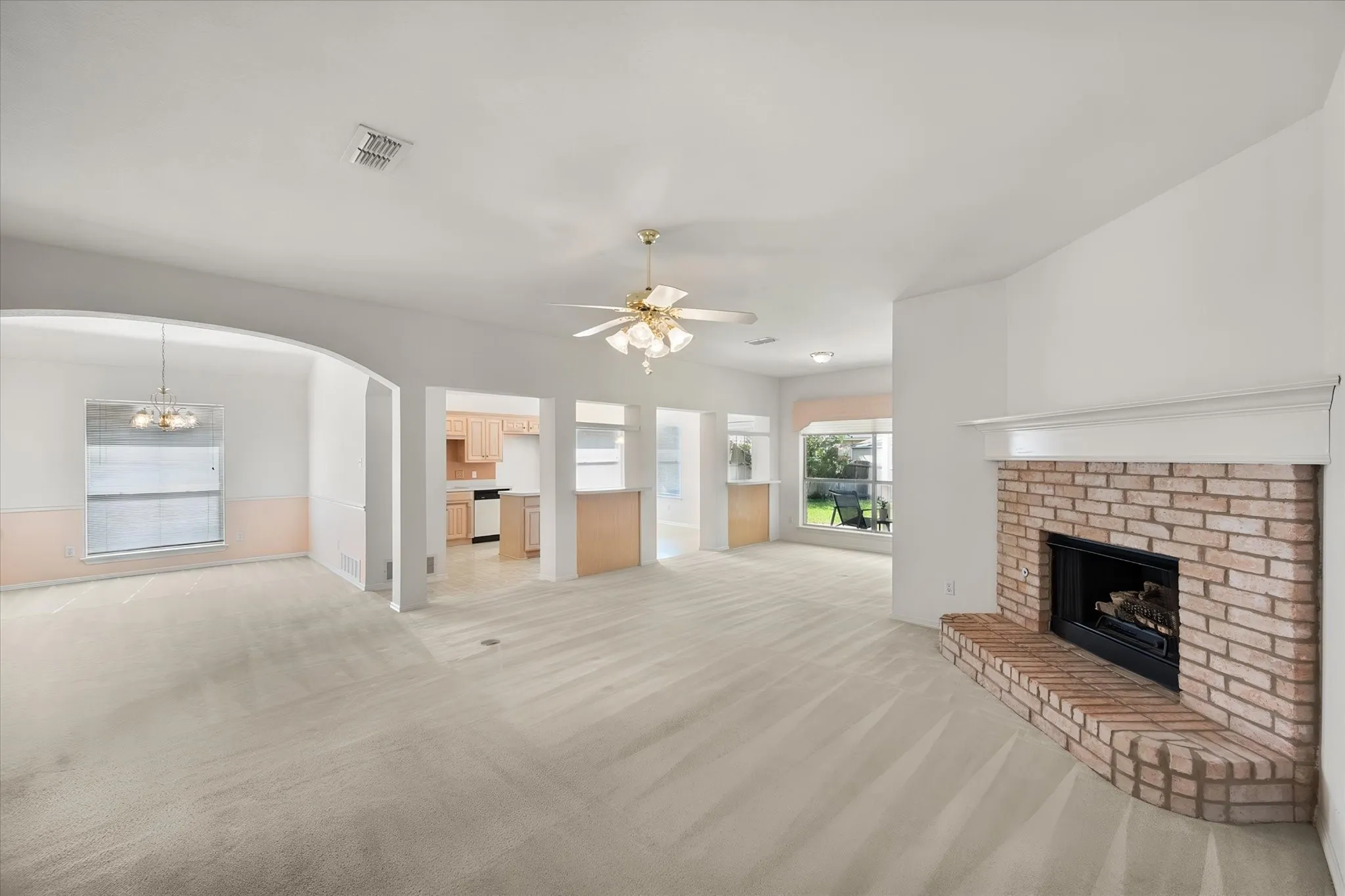 Open concept to living room, dining room, flex area, and kitchen