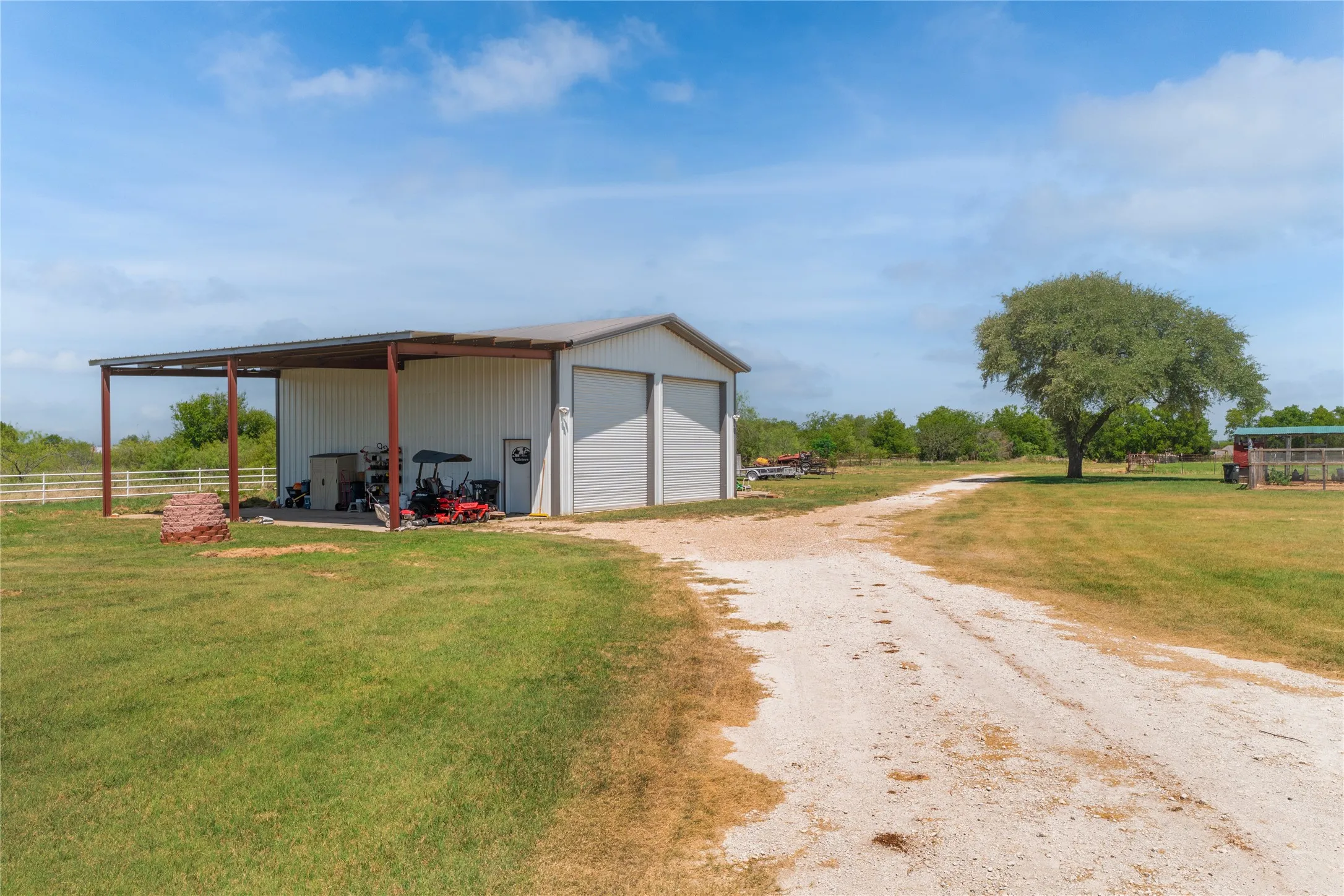 Workshop with roll up door for RV & additional covered parking