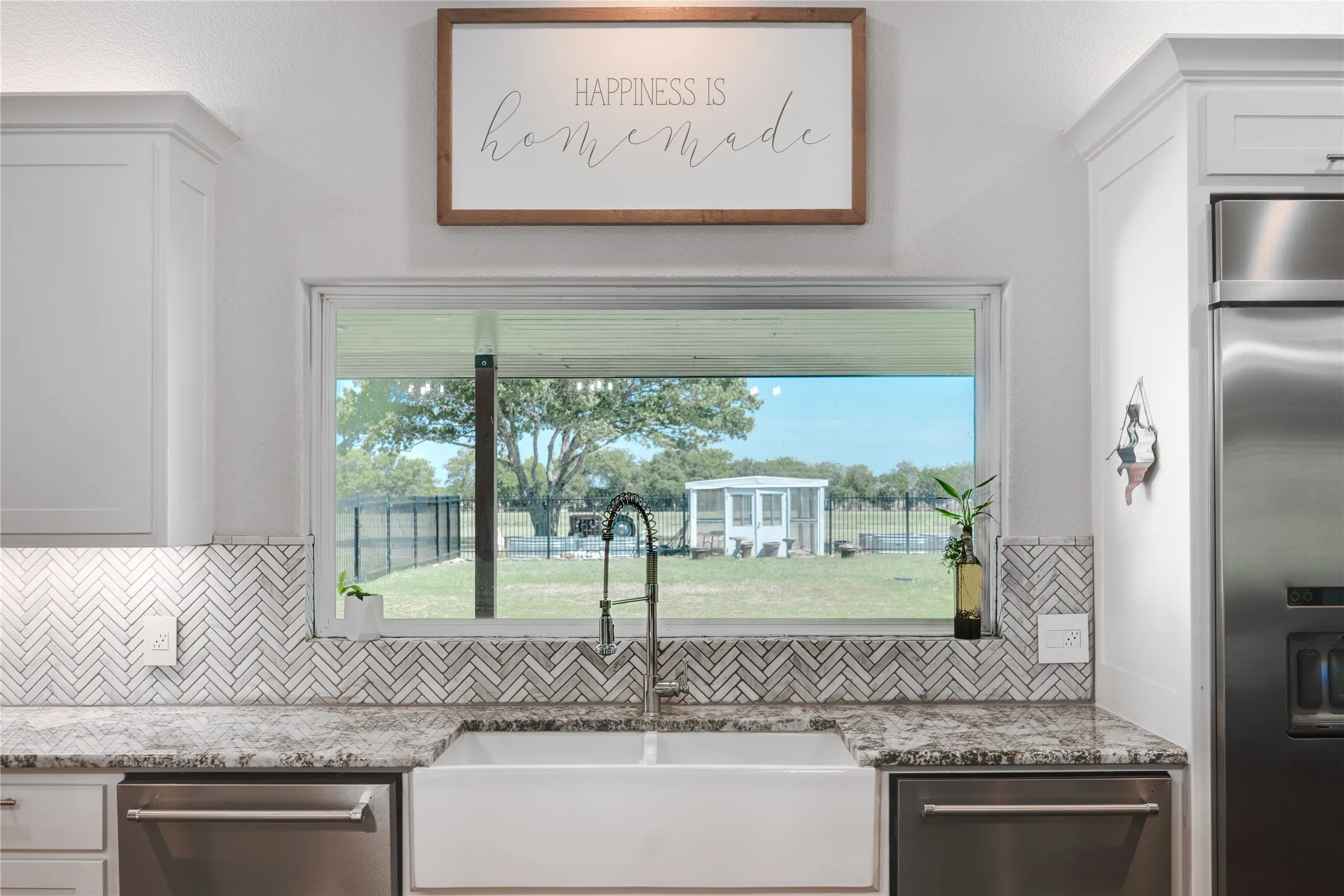 Farm sink with view of acreage