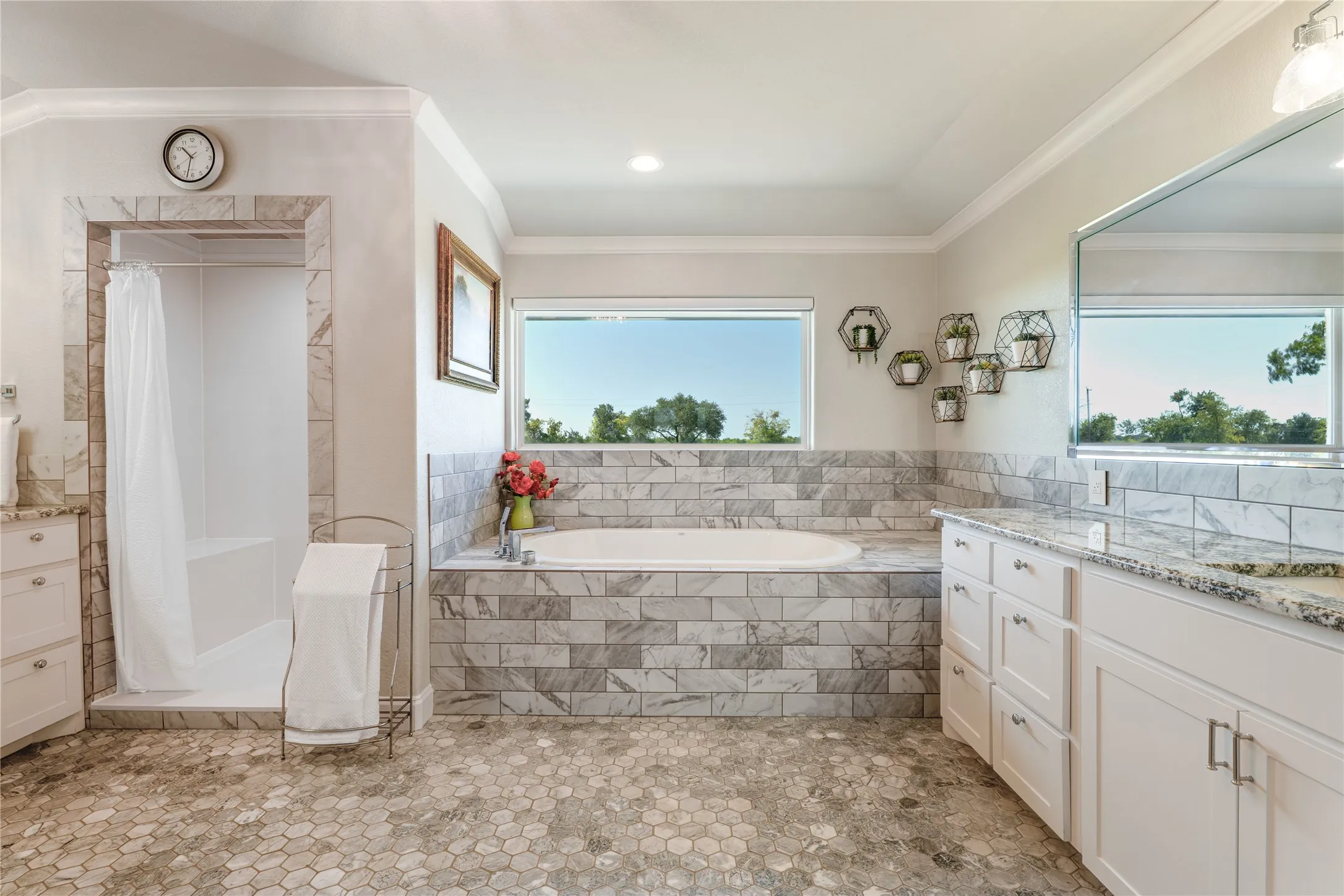 Separate vanities, tub, and shower