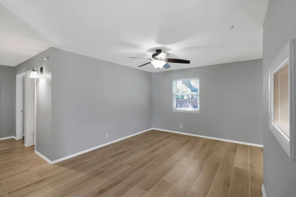 Nice size living room. Taken from front door area.
