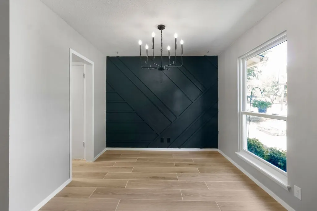 Beautiful accent wall in the dining room and updated light fixture.