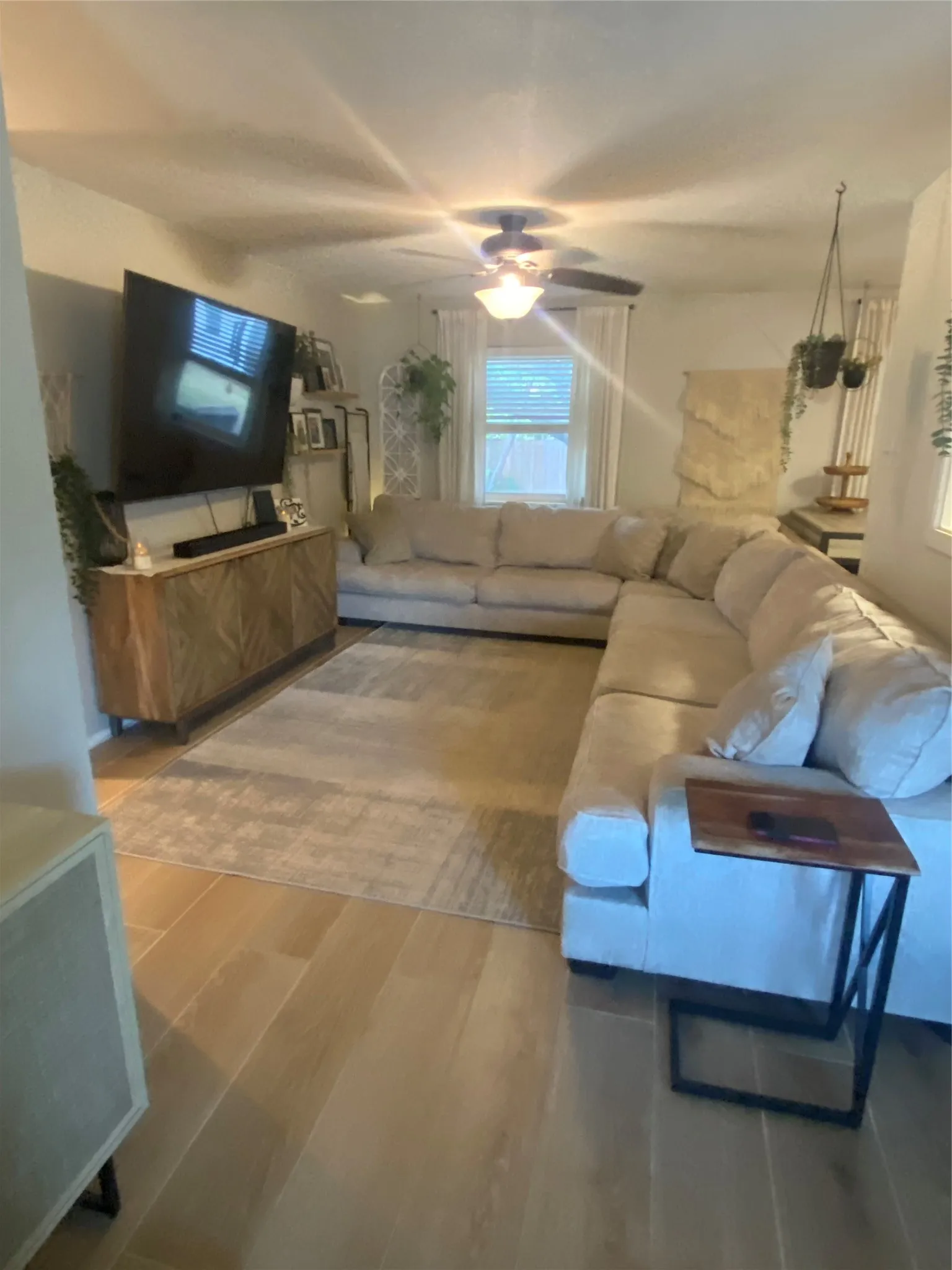 Living room from front door area with sellers large sofa...see the possibilities!