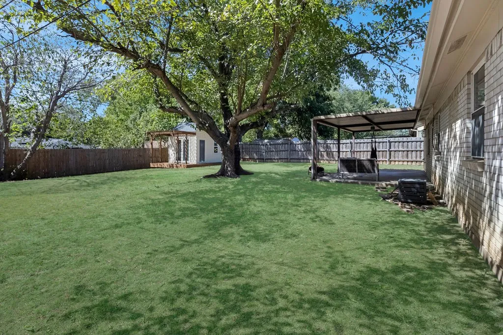 Room for so many uses in this large backyard!