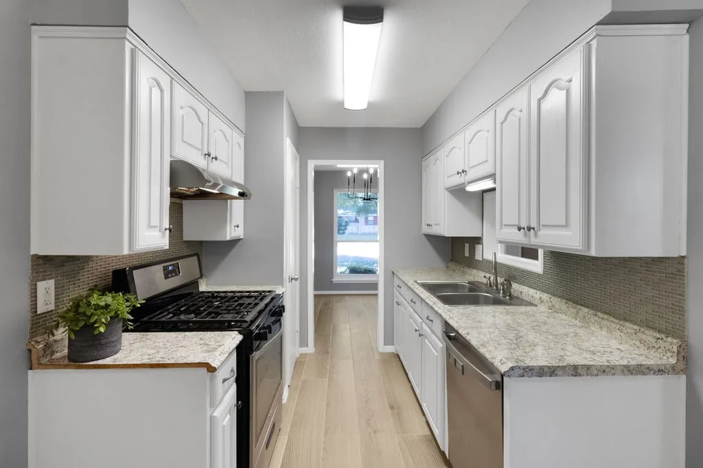 kitchen from the eat-in area towards dining room.  Gas stove and pantry!