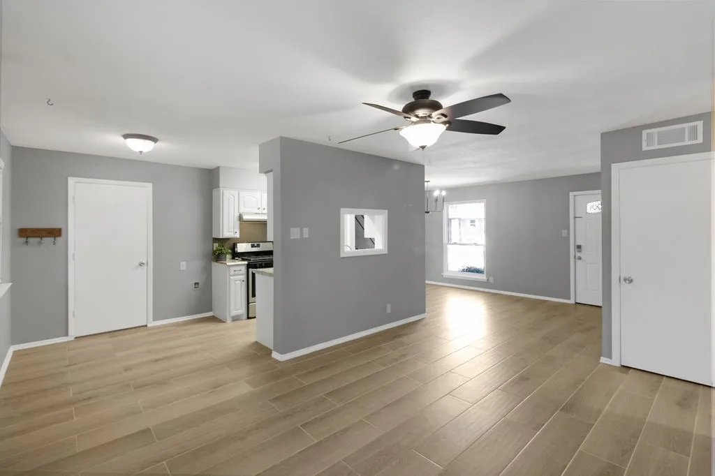Living room into kitchen and eat-in area.  Door on left is into the laundry room.