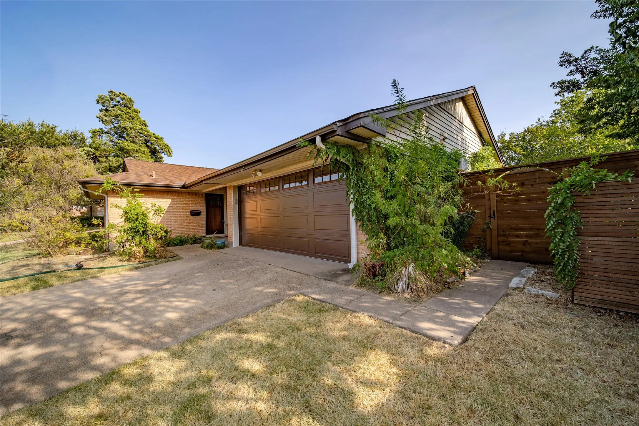From the front driveway, there is a sidewalk that takes you around to the back yard.