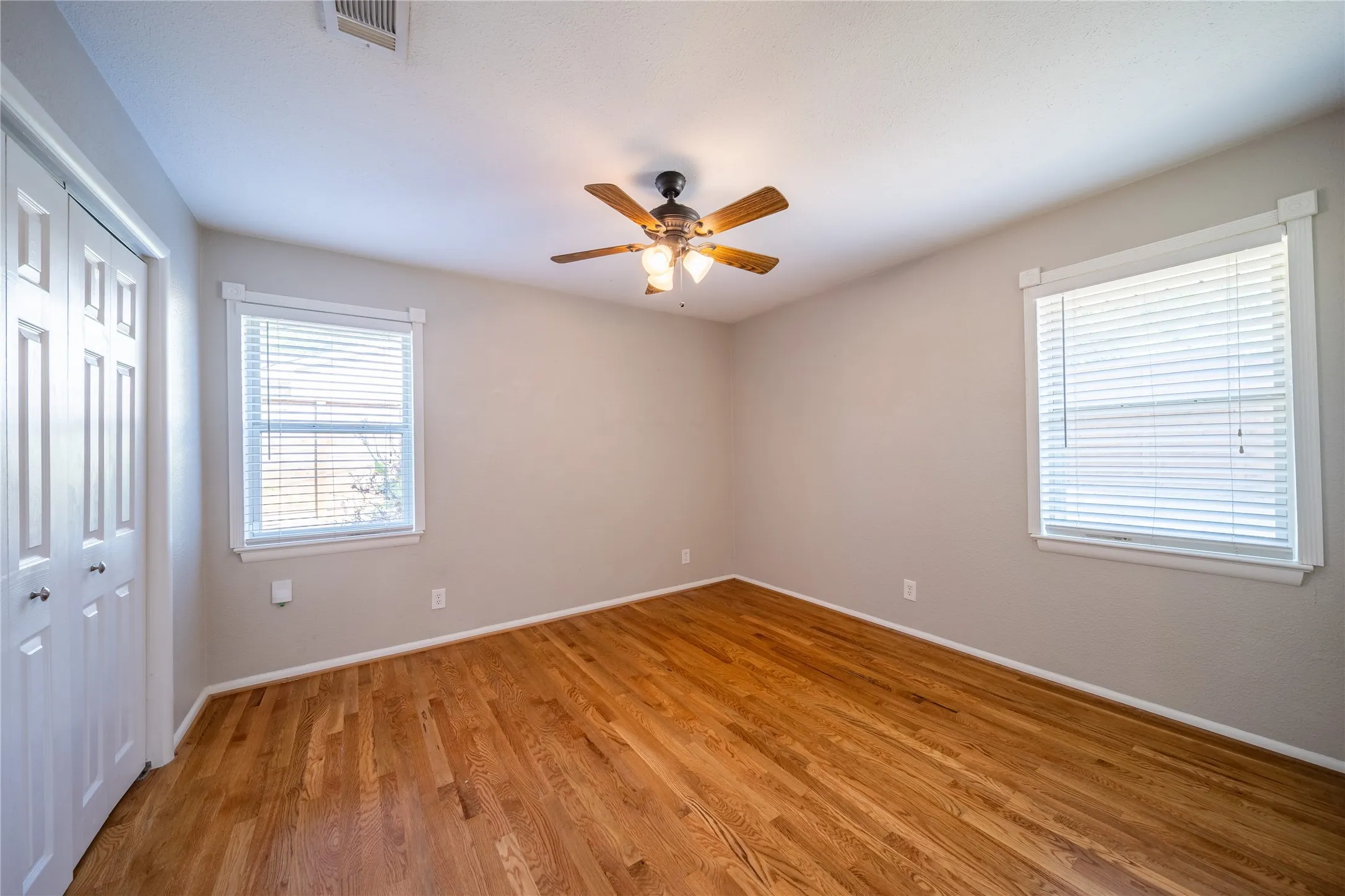 The third bedroom is located at the back of the home with views to the back and side yards.