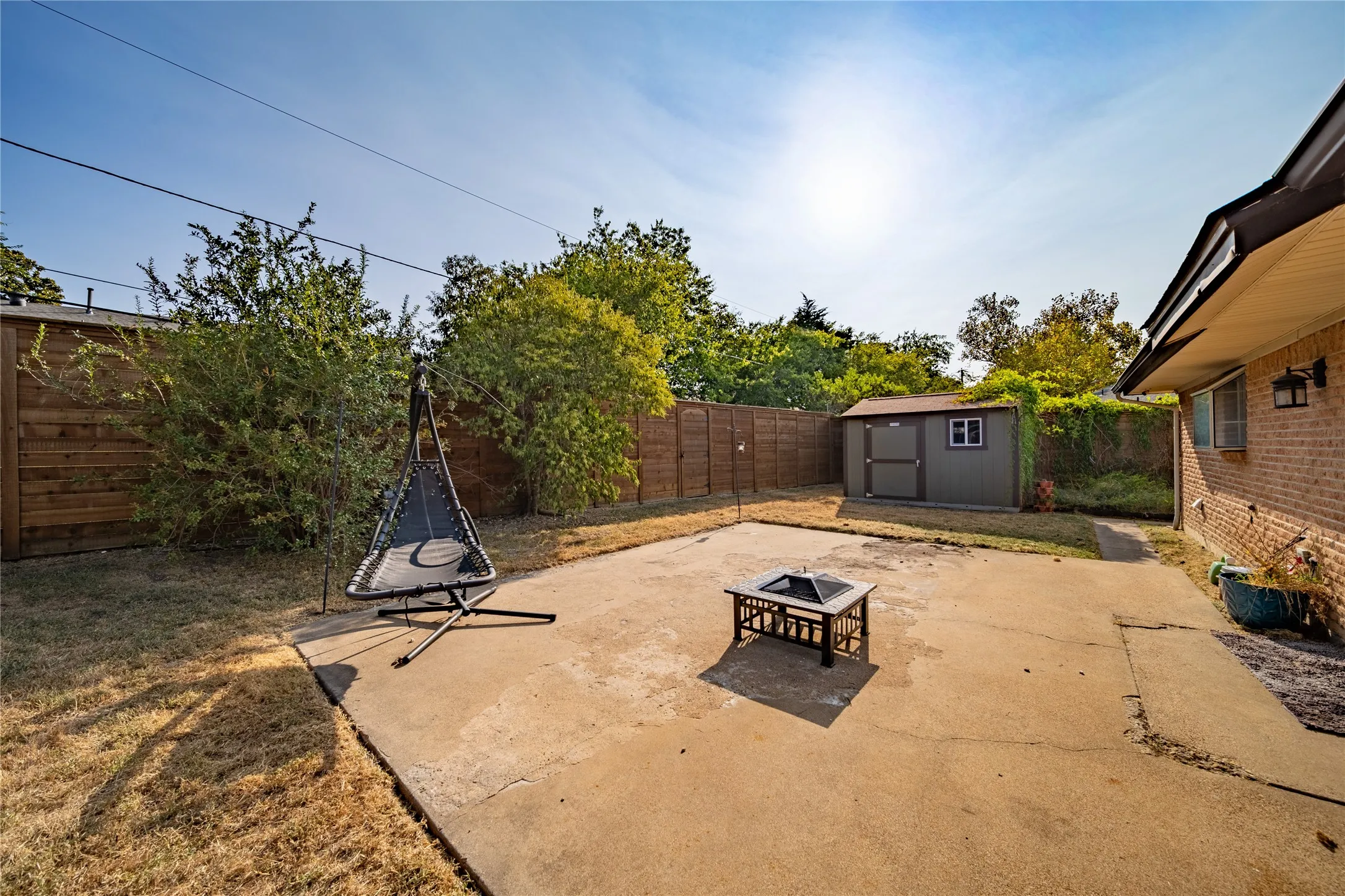 Located in the corner of the back yard is a 9 x 11 Tuff Shed for additional storage.