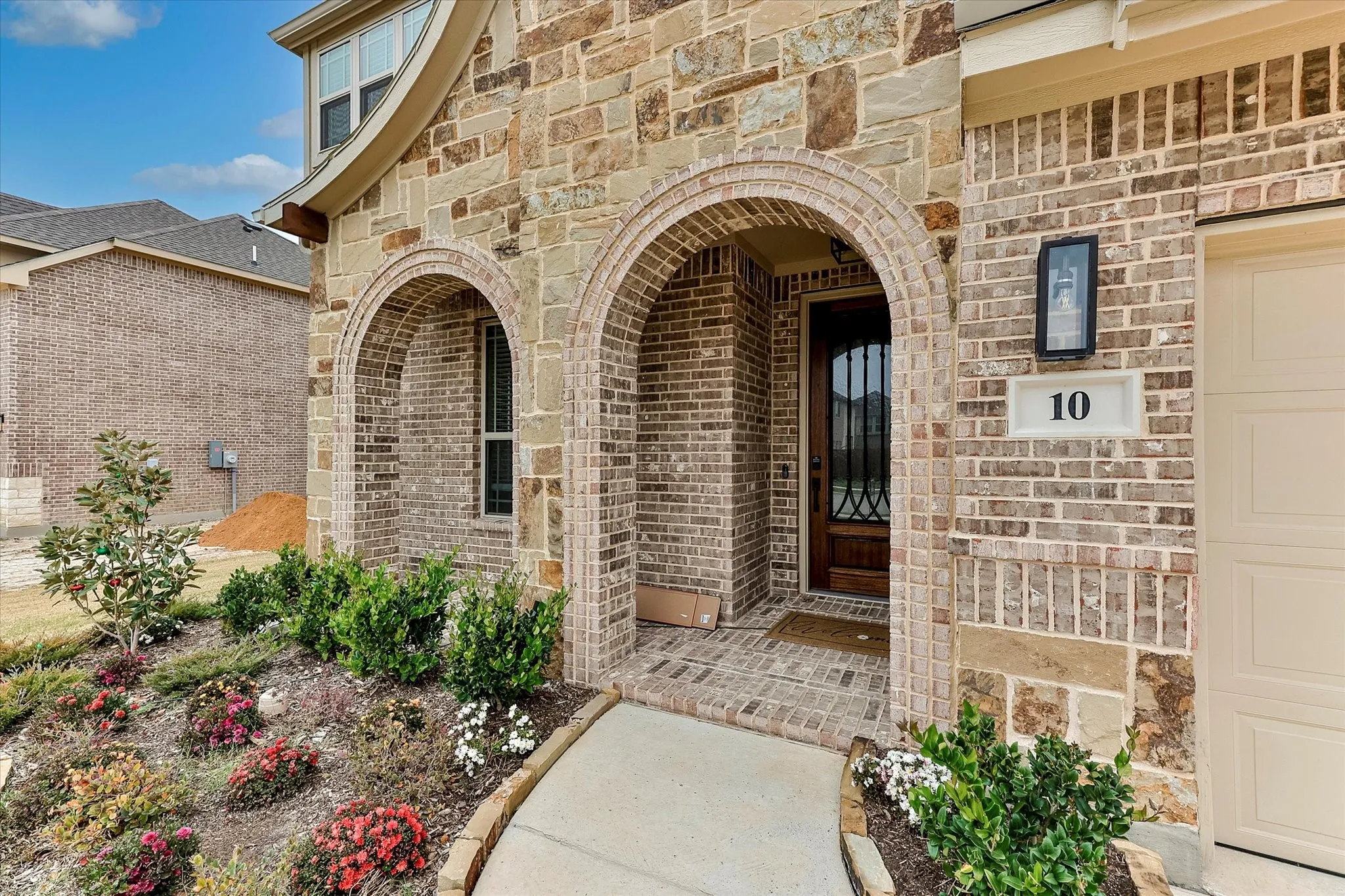 Stone and brick facade with arched entryways