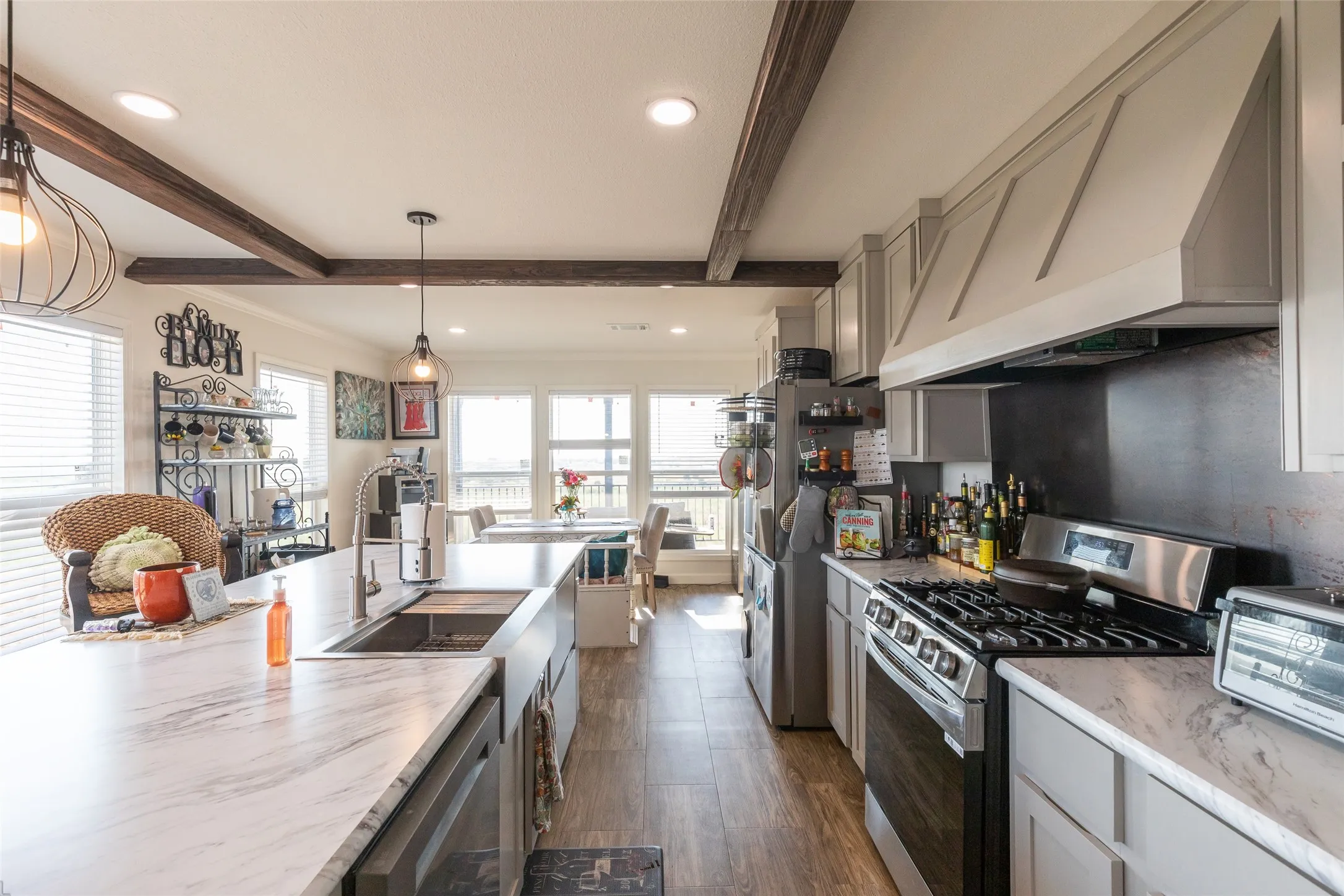 Kitchen with Gas Oven, Dish Washer, and Kitchen Island with built in cabinets and extra storage space!
