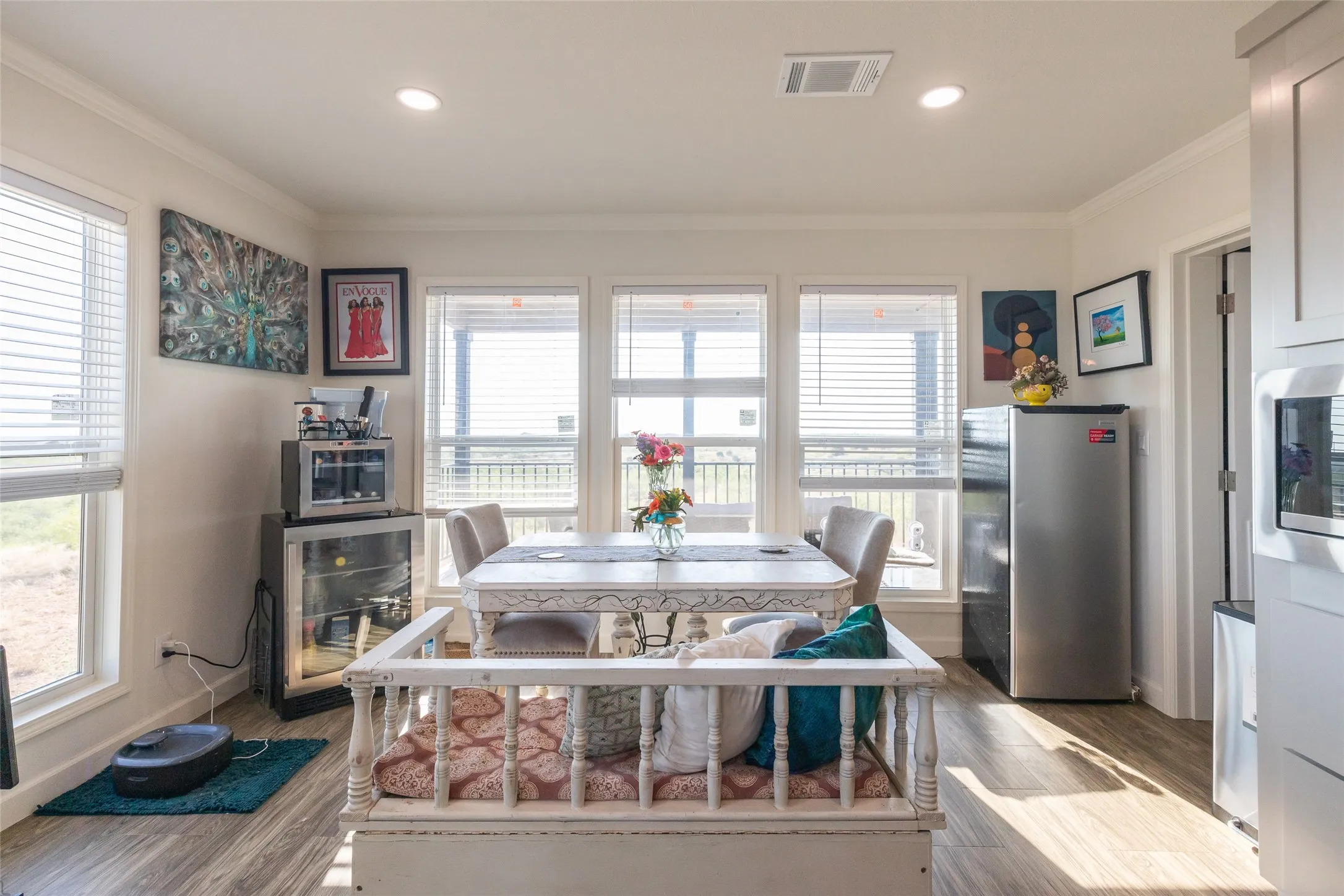 Dining Area with amazing natural lighting! Door on your right goes to the Laundry Room and Back Porch Access